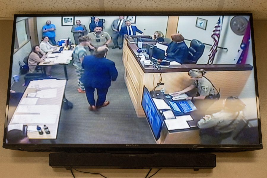 Andrew James McGann, charged with two counts of capital murder, is seen on the video monitor as he appears in front of District Judge Terra Stephenson for his bond hearing at the Washington County Detention Center. Friday, Aug, 1, 2025, in Fayetteville, Ark. (AP Photo/Michael Woods)