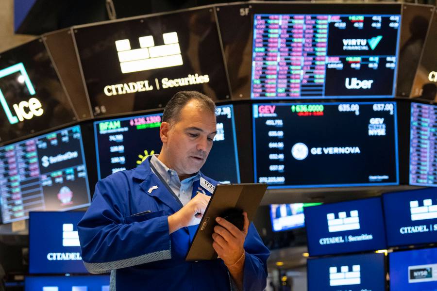 A Trader works on the floor of the New York Stock Exchange, Friday, Aug. 1, 2025, in New York. (AP Photo/Yuki Iwamura)