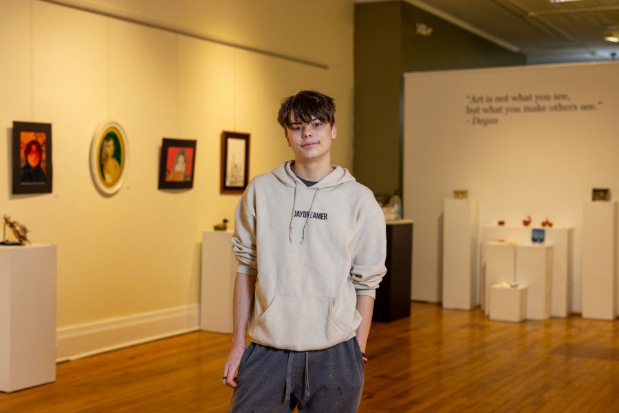 Briar Townes, a senior at Perry Central High School, poses for a portrait inside the Arts Council for Wyoming County, where he has art displayed as part of an All-County High School Arts Show, on March 12, 2025, in Perry, N.Y. (AP Photo/Lauren Petracca)