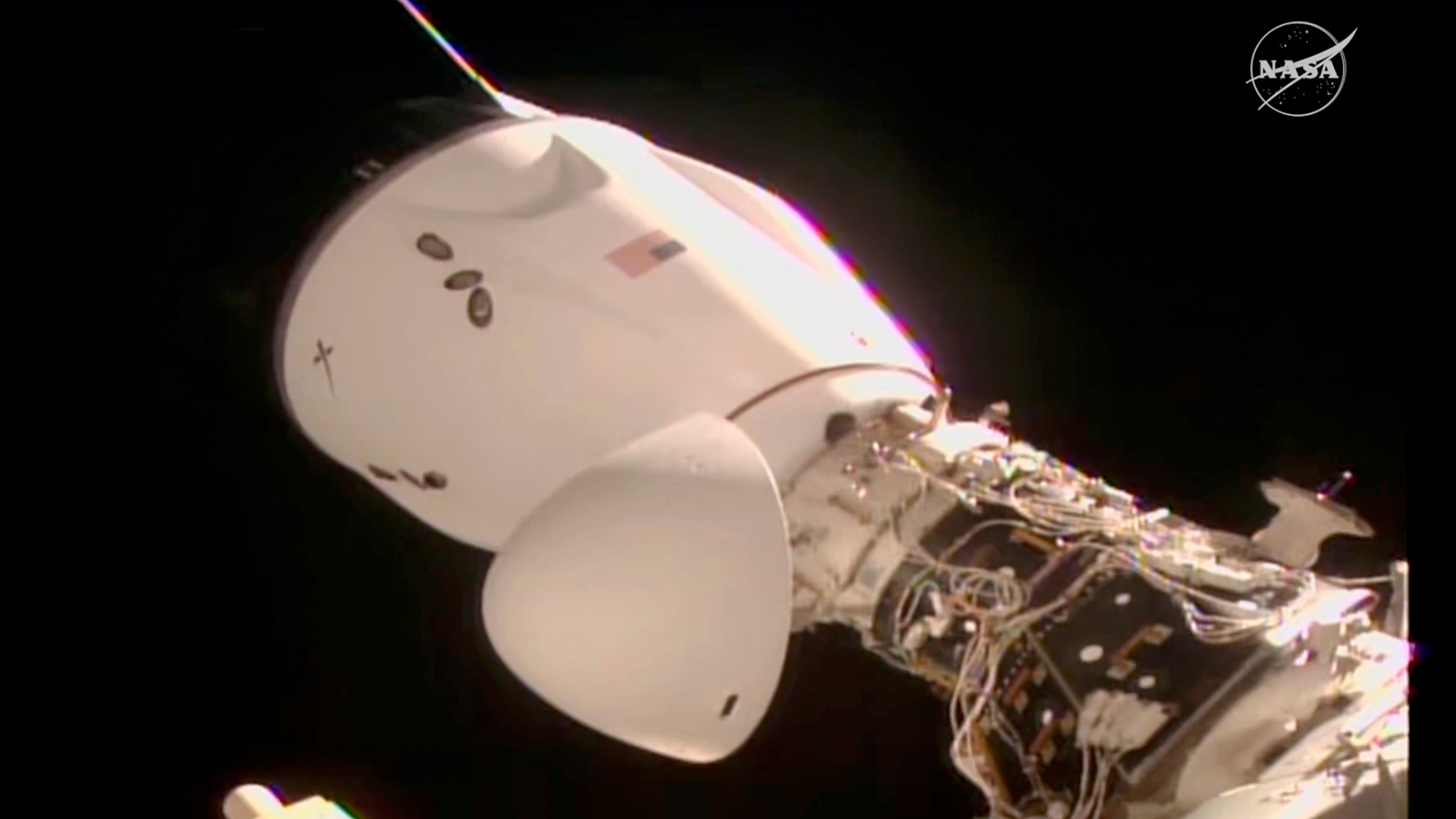 This image made from video provided by NASA and SpaceX shows the docked SpaceX capsule to the International Space Station Saturday Aug. 2, 2025. (NASA and SpaceX via AP)