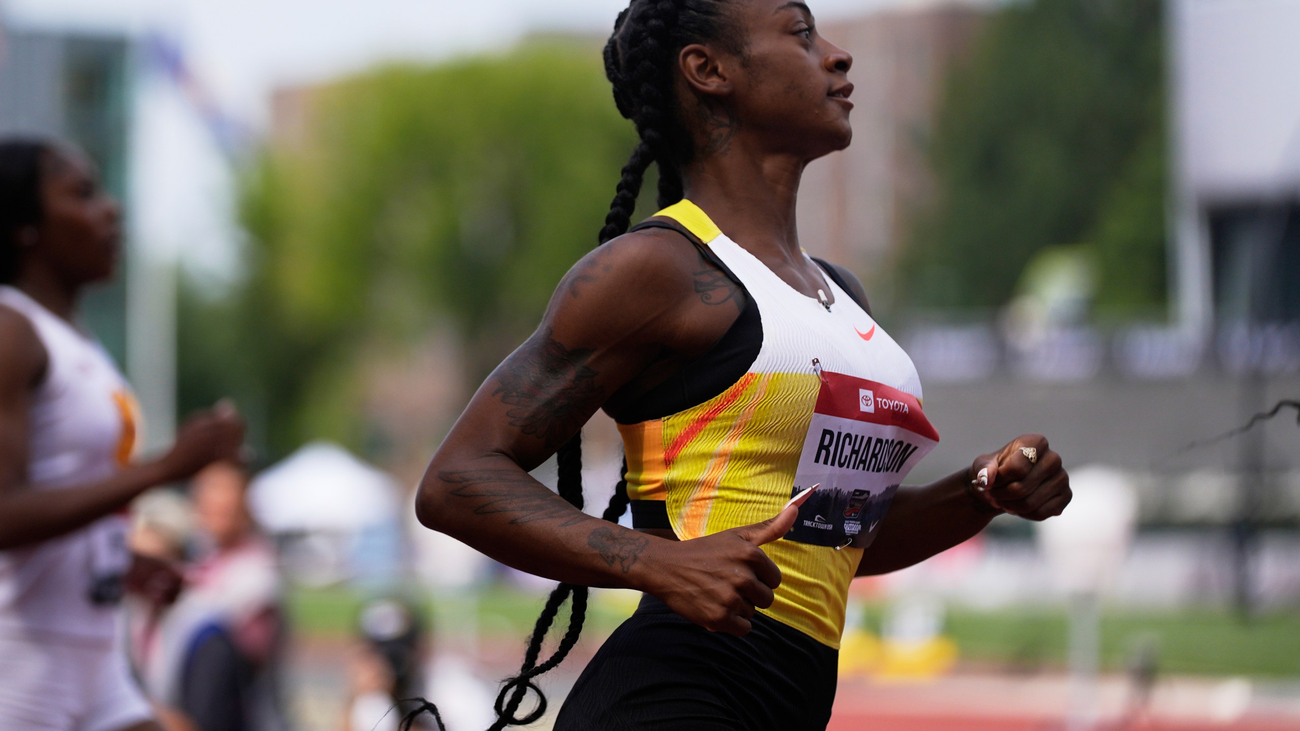 Sha'Carri Richardson reacts after the first heat in the first round of the women's 100-meter at the U.S. Championships athletics meet in Eugene, Ore., Thursday, July 31, 2025. (AP Photo/Abbie Parr)