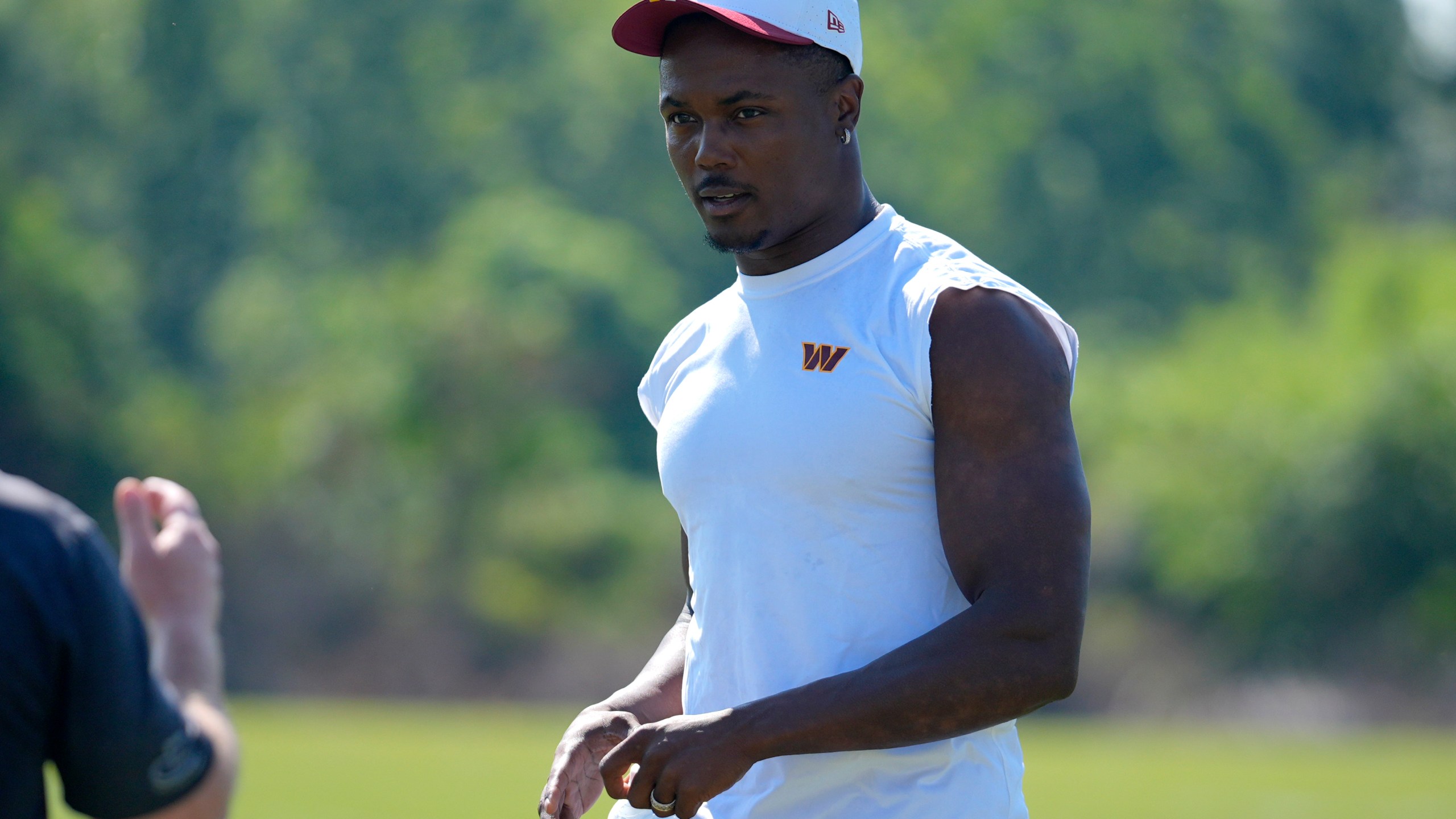 Washington Commanders wide receiver Terry McLaurin walks across the field after a practice at the team's NFL football training camp, Sunday, July 27, 2025, in Ashburn, Va. (AP Photo/Mark Schiefelbein)