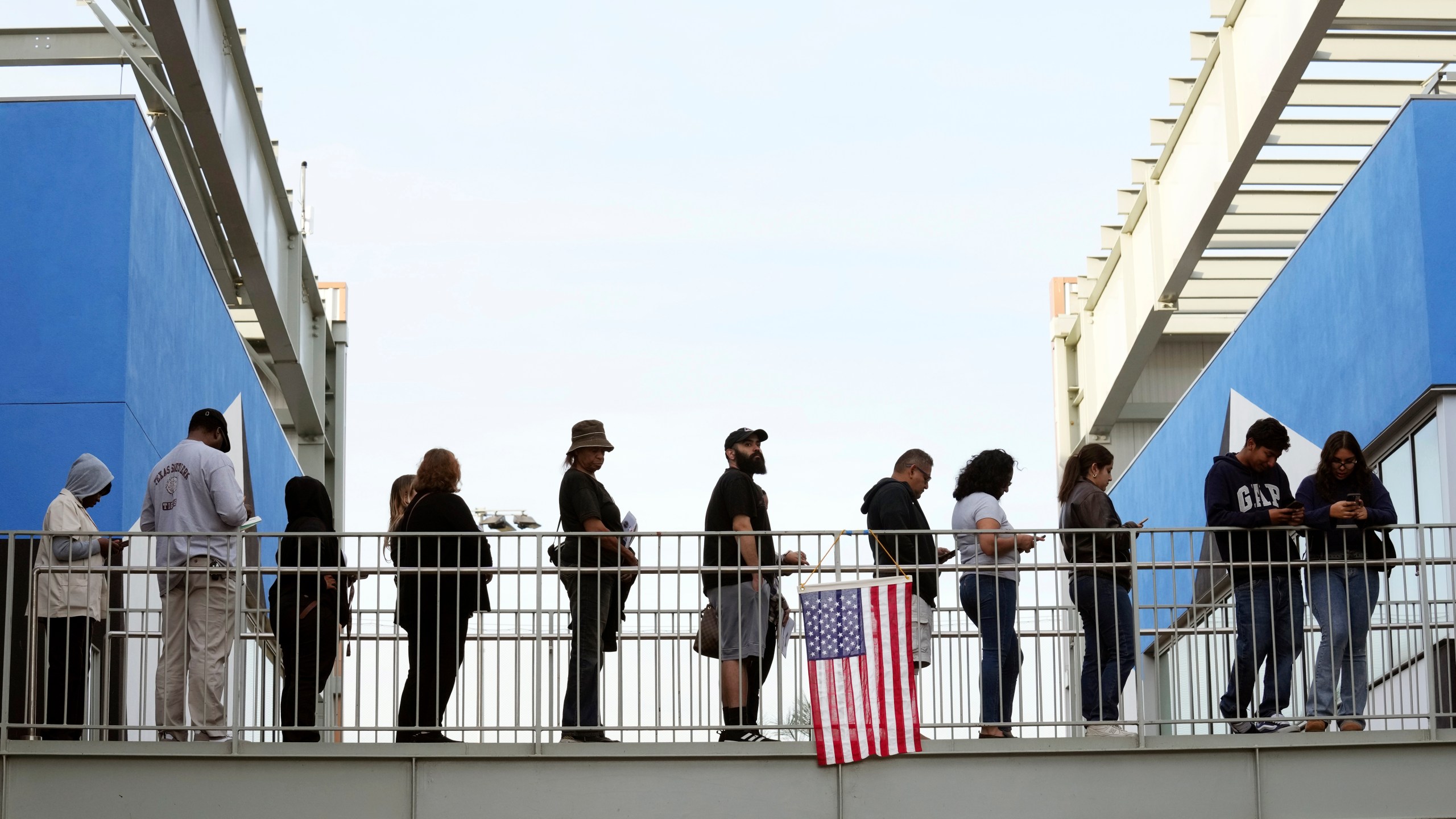 FILE - Voters wait in a long line at a polling place at the Michelle and Barack Obama Sports Complex on Election Day, Nov. 5, 2024, in Los Angeles. (AP Photo/Chris Pizzello, File)