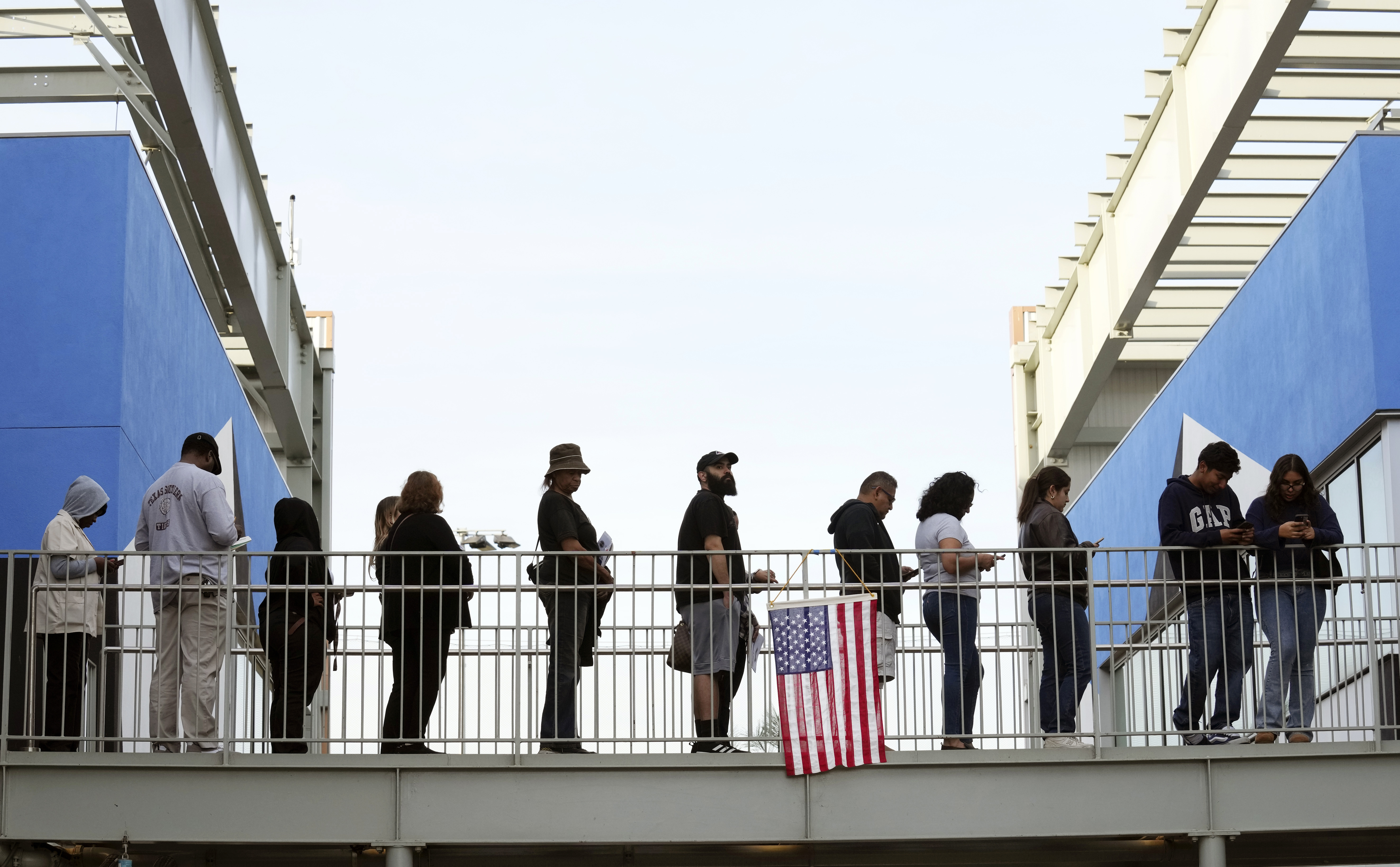 FILE - Voters wait in a long line at a polling place at the Michelle and Barack Obama Sports Complex on Election Day, Nov. 5, 2024, in Los Angeles. (AP Photo/Chris Pizzello, File)