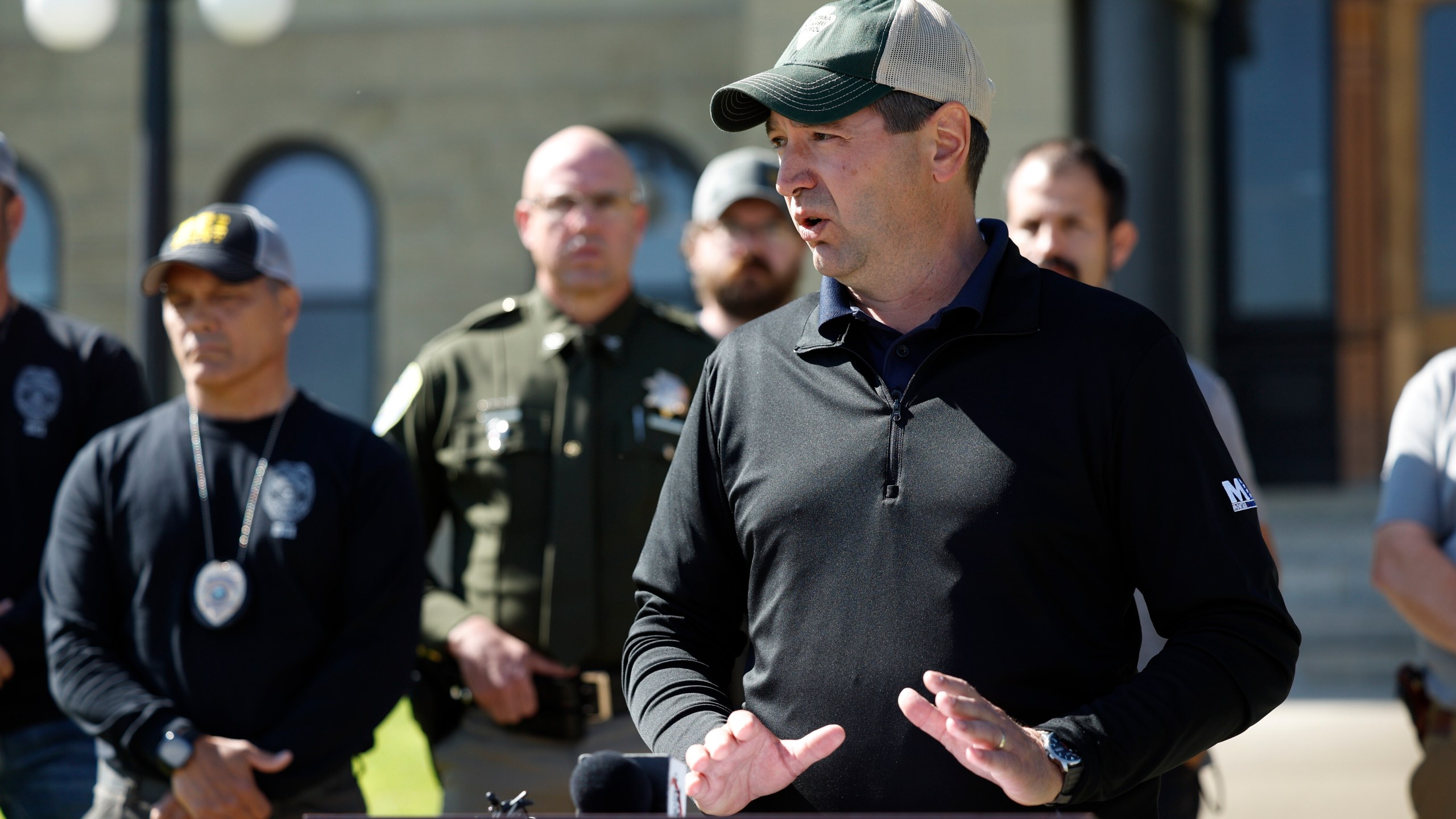 Montana Attorney General Austin Knudsen speaks to the media Sunday, Aug. 3, 2025 in front of the Anaconda-Deer Lodge County Courthouse in Anaconda, Mont., about the ongoing search for shooting suspect Michael Brown. (Joseph Scheller/The Montana Standard via AP)