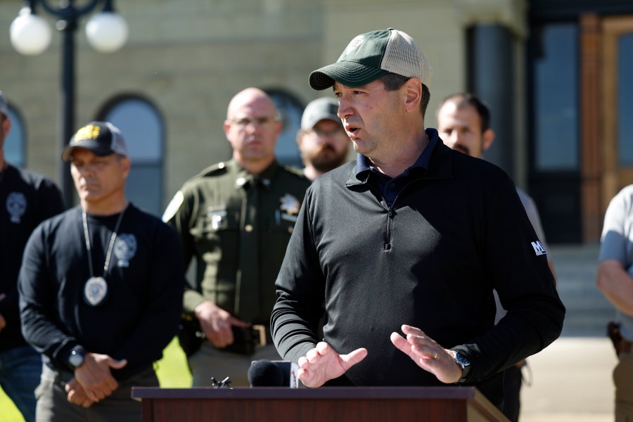 Montana Attorney General Austin Knudsen speaks to the media Sunday, Aug. 3, 2025 in front of the Anaconda-Deer Lodge County Courthouse in Anaconda, Mont., about the ongoing search for shooting suspect Michael Brown. (Joseph Scheller/The Montana Standard via AP)