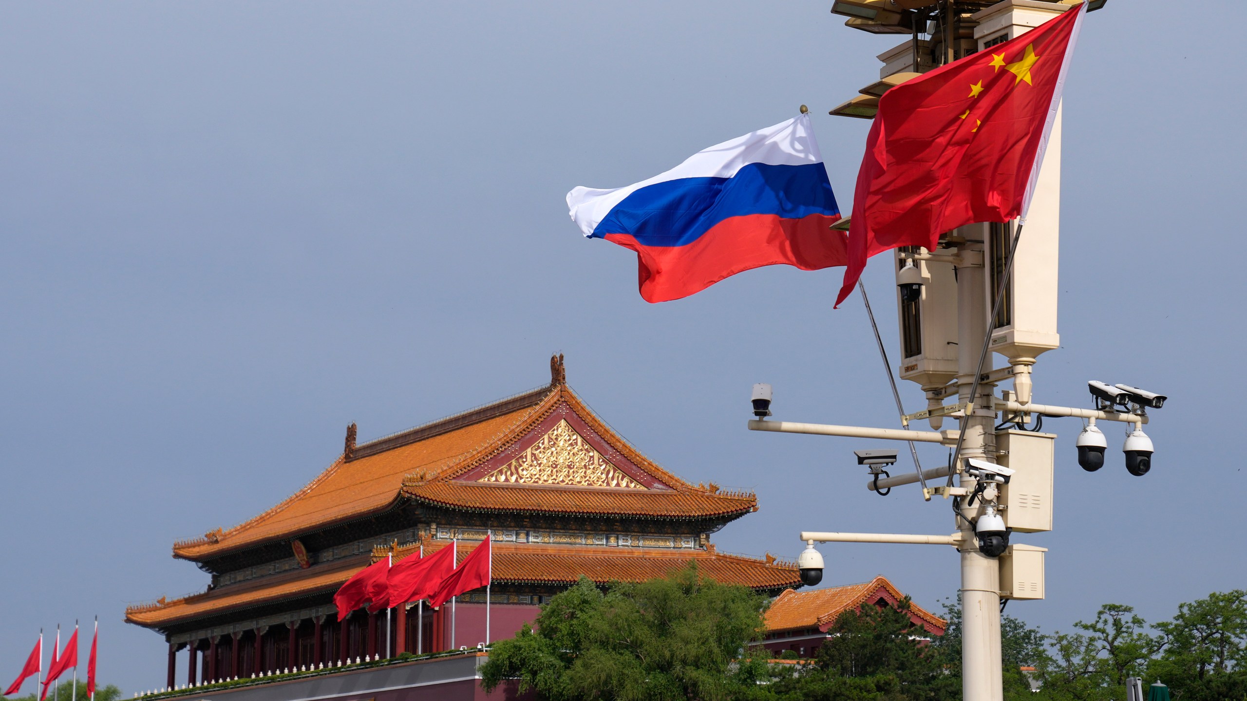 FILE - A Russian and Chinese national flag flutter near Tiananmen Gate for the visiting Russia's President Vladimir Putin, in Beijing, May 16, 2024. (AP Photo/Andy Wong, File)