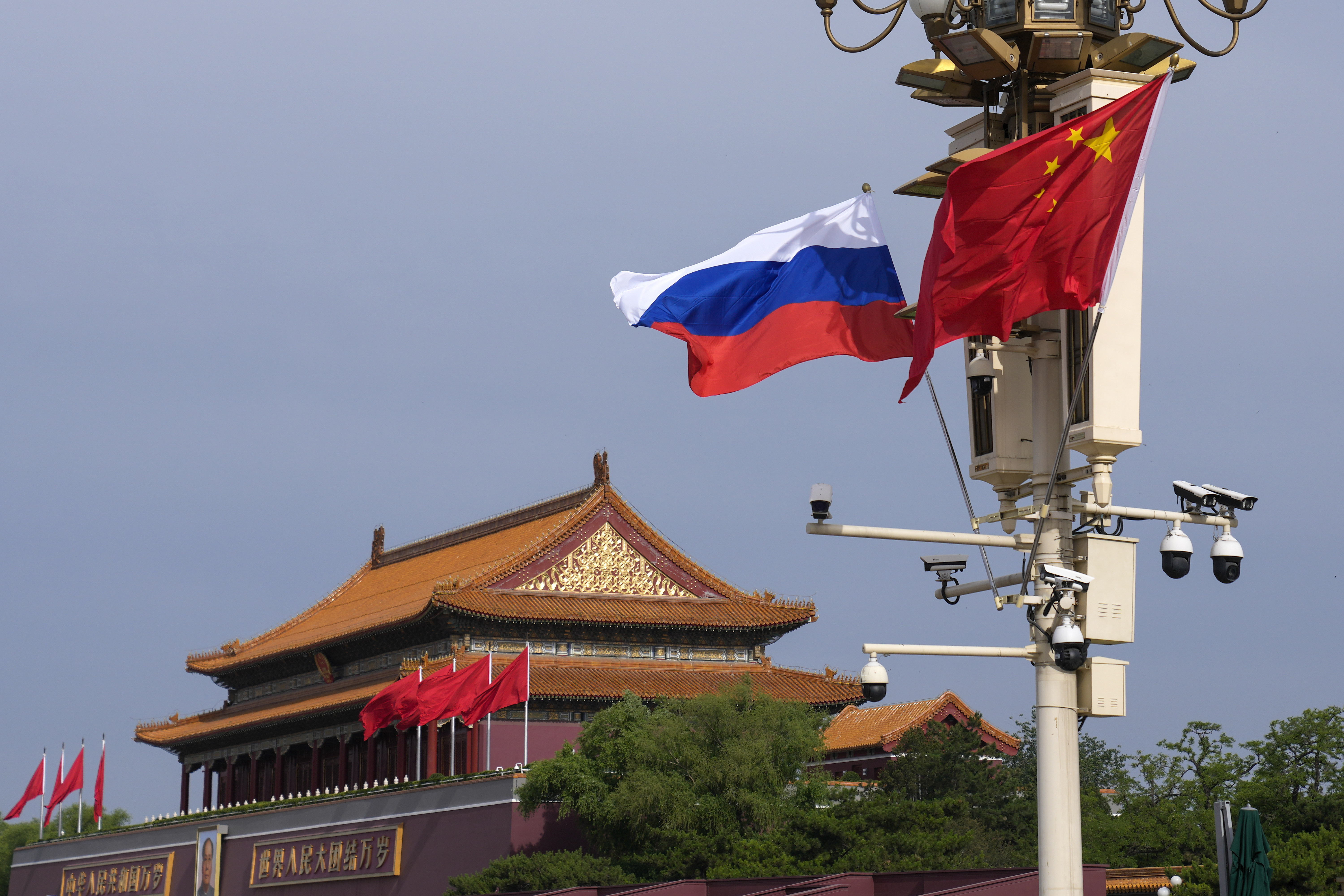 FILE - A Russian and Chinese national flag flutter near Tiananmen Gate for the visiting Russia's President Vladimir Putin, in Beijing, May 16, 2024. (AP Photo/Andy Wong, File)