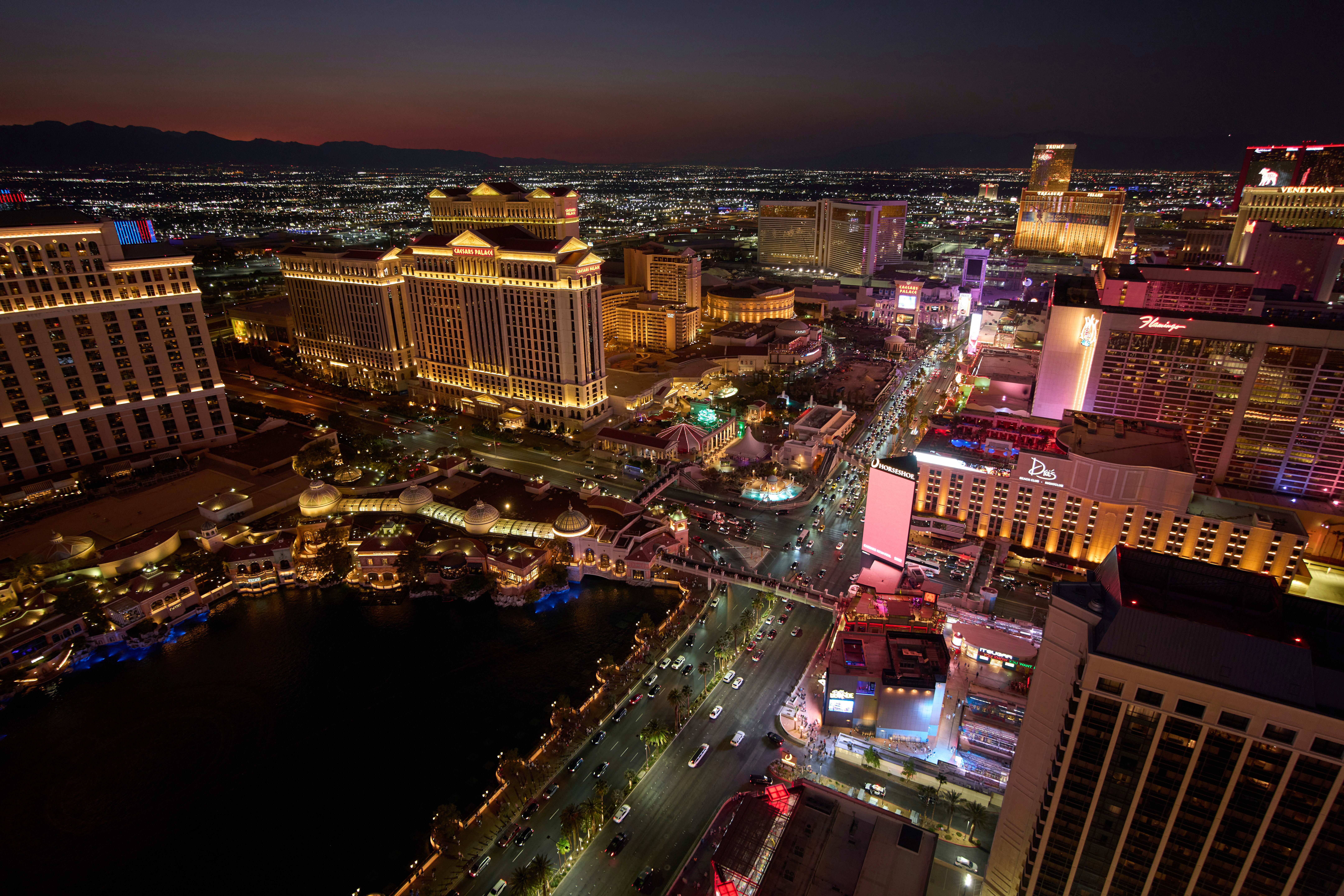 Cars drive along the Las Vegas Strip, Saturday, Aug. 2, 2025, in Las Vegas. (AP Photo/John Locher)