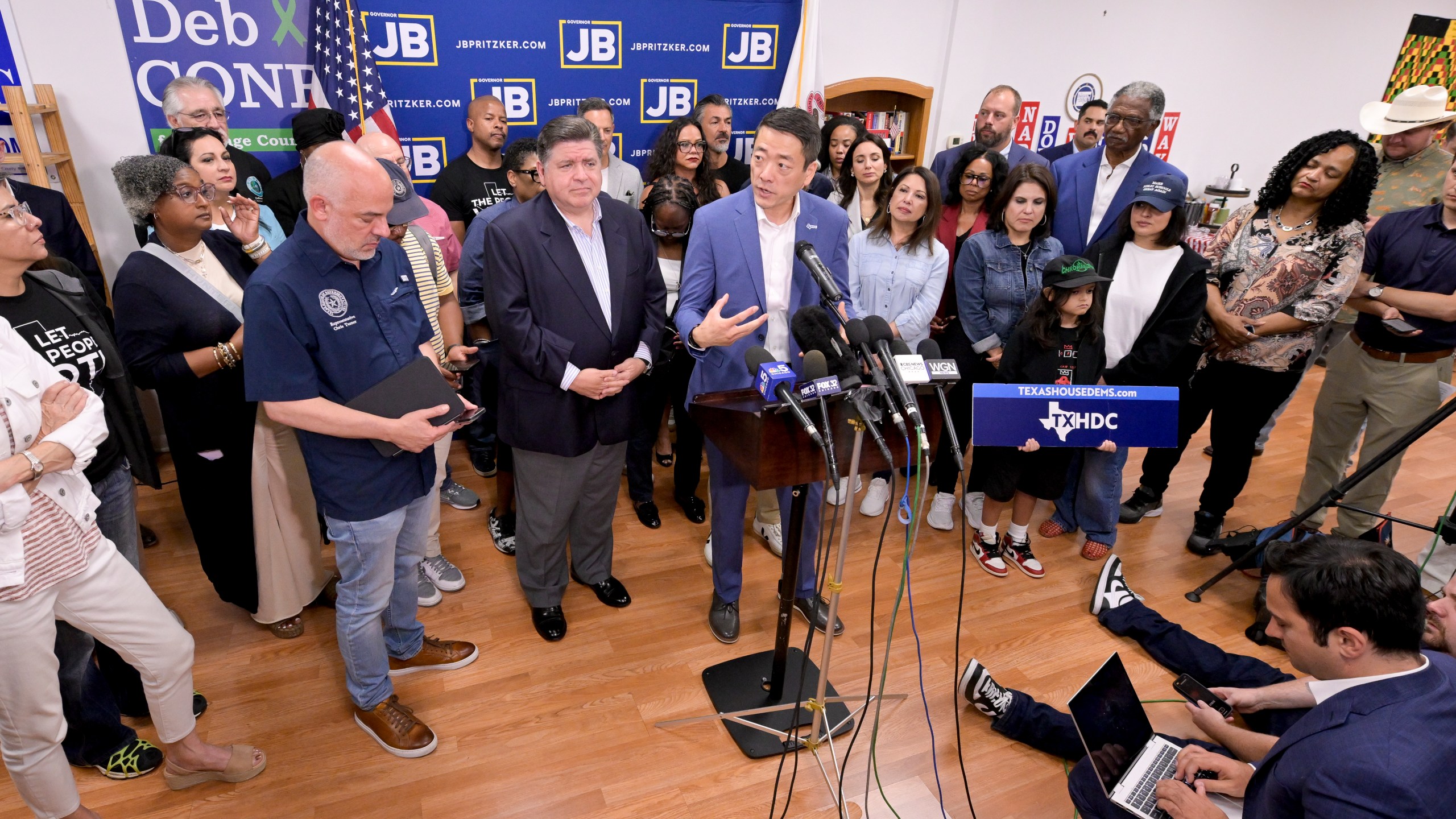 Texas House Democratic Caucus Chair Gene Wu along with other members of the Texas House are joined by Illinois Governor JB Pritzker as they speak about Texas Republican plans to redraw the House map office during a press conference at the Democratic Party of DuPage County office in Carol Stream, IL on Sunday, Aug. 3, 2025. (AP Photo/Mark Black)