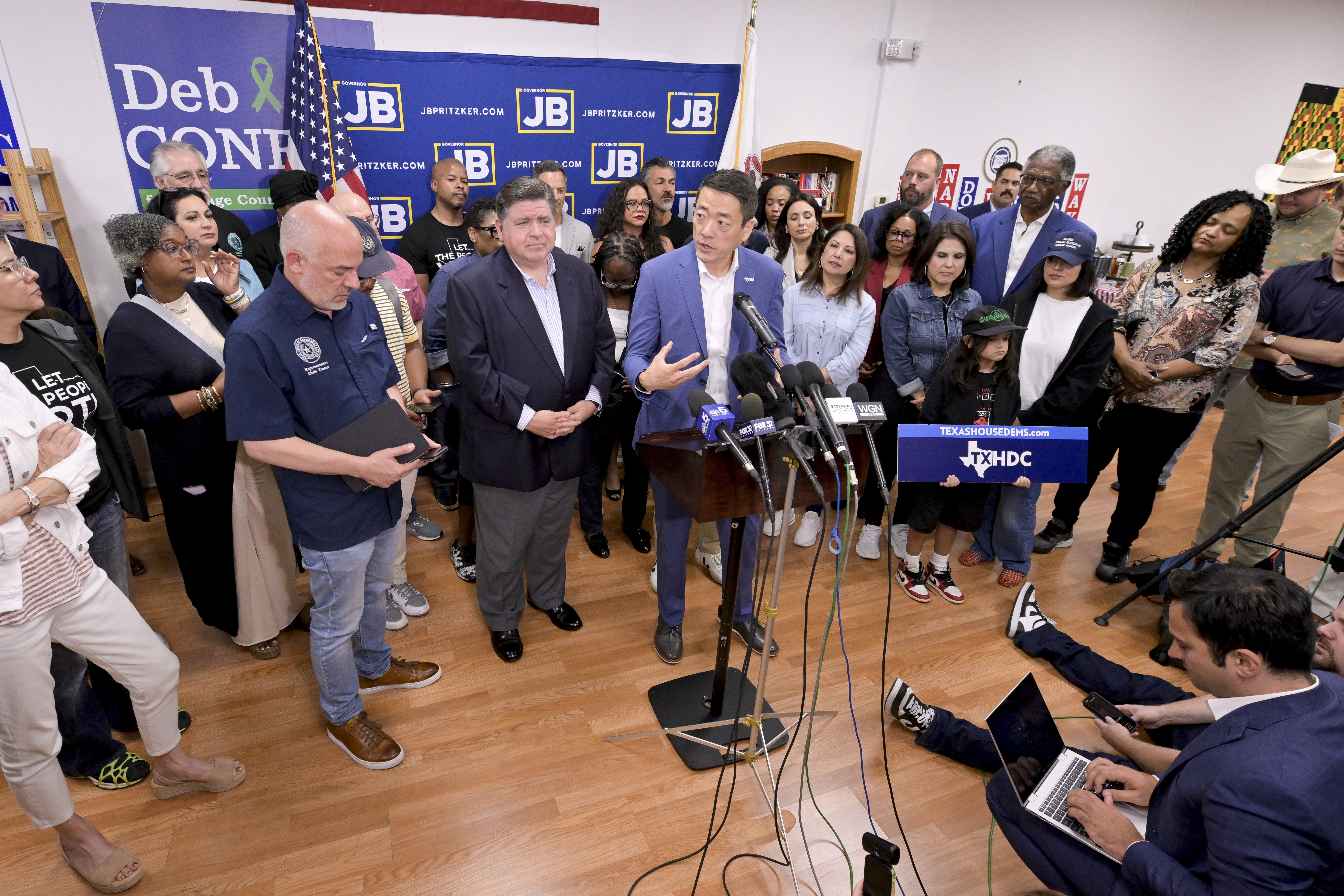 Texas House Democratic Caucus Chair Gene Wu along with other members of the Texas House are joined by Illinois Governor JB Pritzker as they speak about Texas Republican plans to redraw the House map office during a press conference at the Democratic Party of DuPage County office in Carol Stream, IL on Sunday, Aug. 3, 2025. (AP Photo/Mark Black)