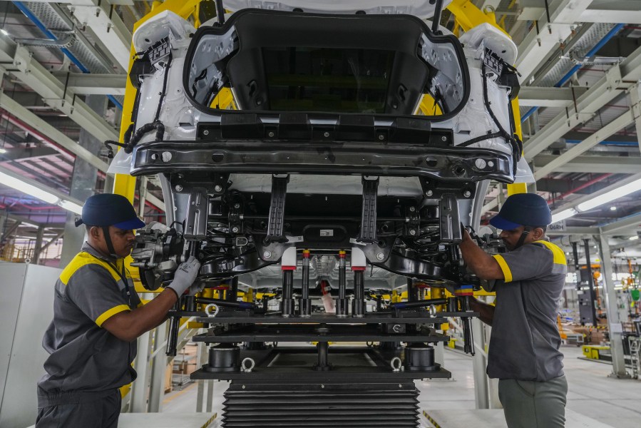 Workers assemble a car at the Vinfast electric vehicle plant in Thoothukudi, in the southern Indian state of Tamil Nadu, Monday, Aug. 4, 2025. (AP Photo/ Rafiq Maqbool)