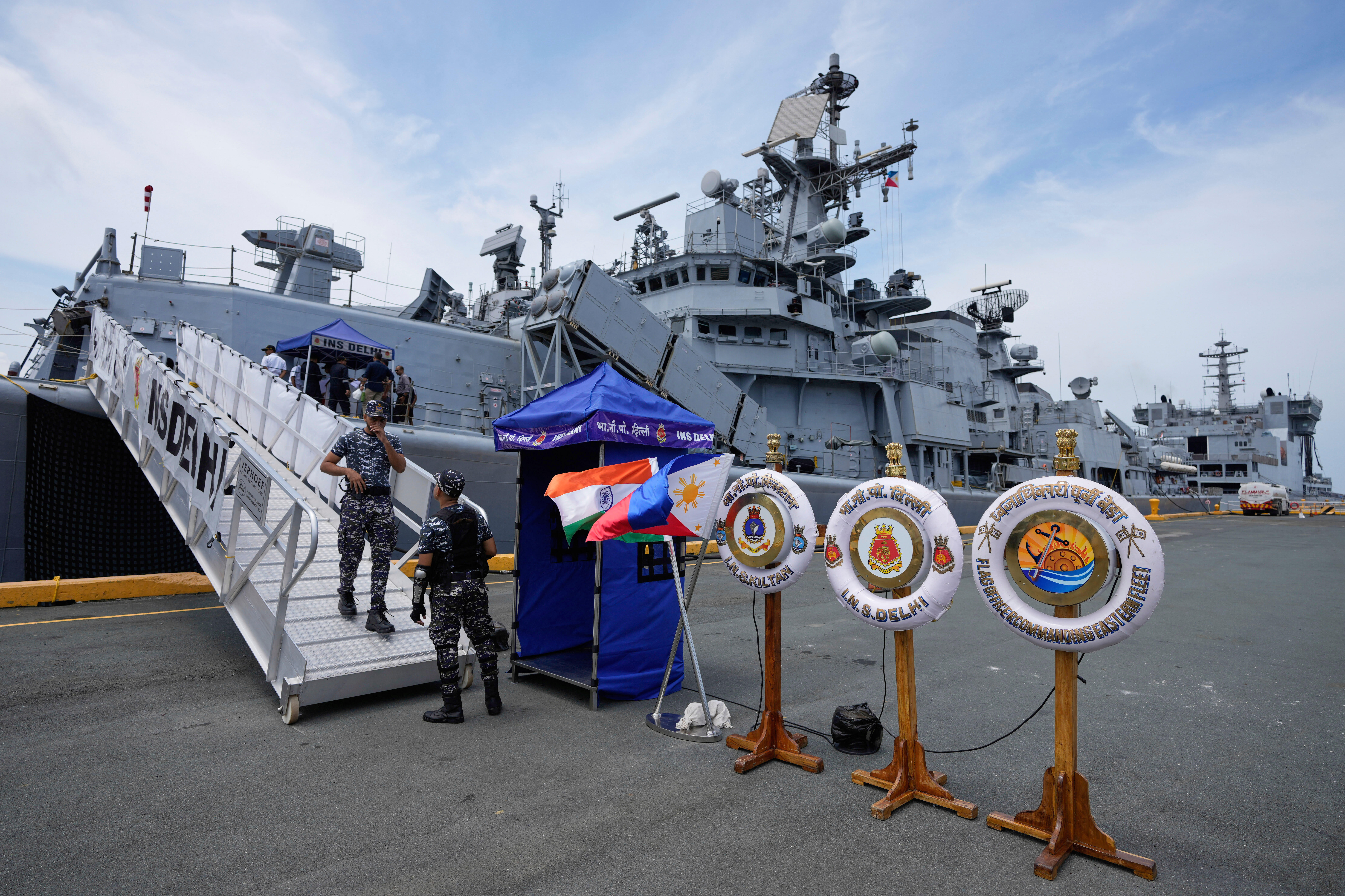 A crew disembarks the Indian navy ship guided-missile destroyer, INS Delhi, that is docked at Manila's port, Philippines, on Friday, Aug. 1, 2025. (AP Photo/Aaron Favila)