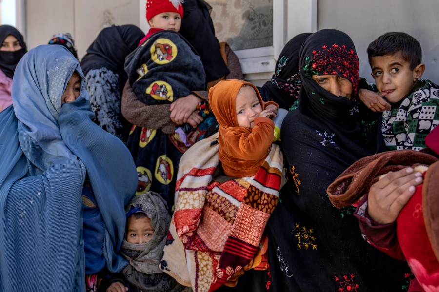 FILE - Mothers along with babies who suffer from malnutrition wait to receive help and check-up at a clinic that run by the WFP, in Kabul, Afghanistan, Thursday, Jan. 26, 2023. (AP Photo/Ebrahim Noroozi, File)