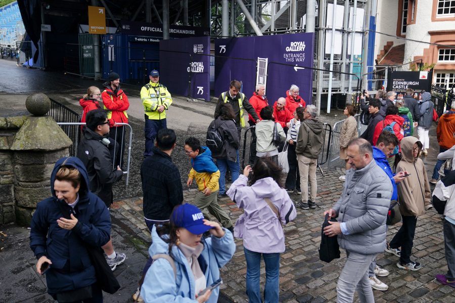 Members of the public are turned away from Edinburgh Castle as the site is closed to visitors due to high winds, in Scotland, Monday Aug. 4, 2025, as weather warnings are coming into force with Storm Floris expected to cause severe travel disruption to road, air and ferry services, and close bridges. (Jane Barlow/PA via AP)