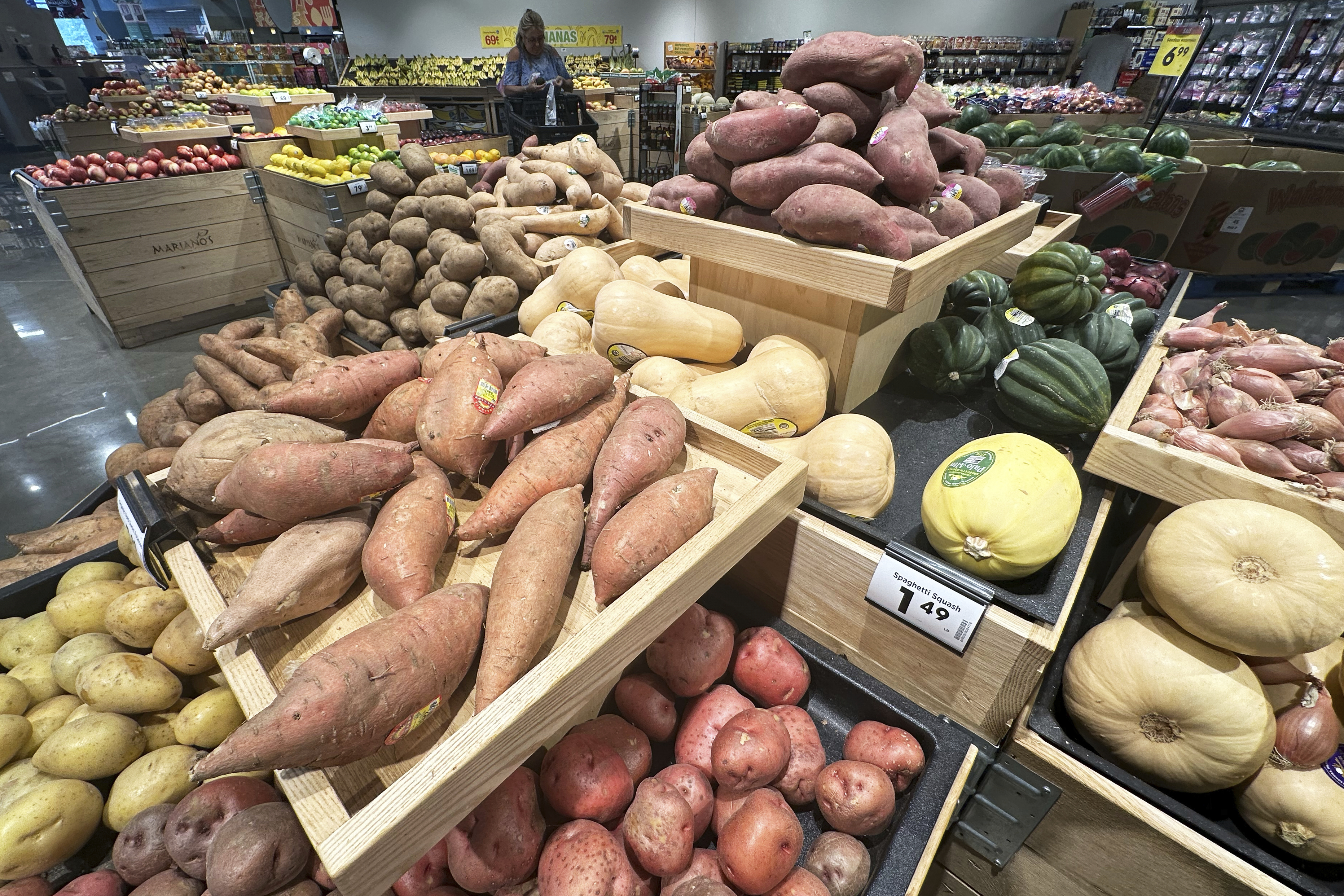 FILE - A customer shops at a grocery store in Glenview, Ill., July 15, 2025. (AP Photo/Nam Y. Huh, File)