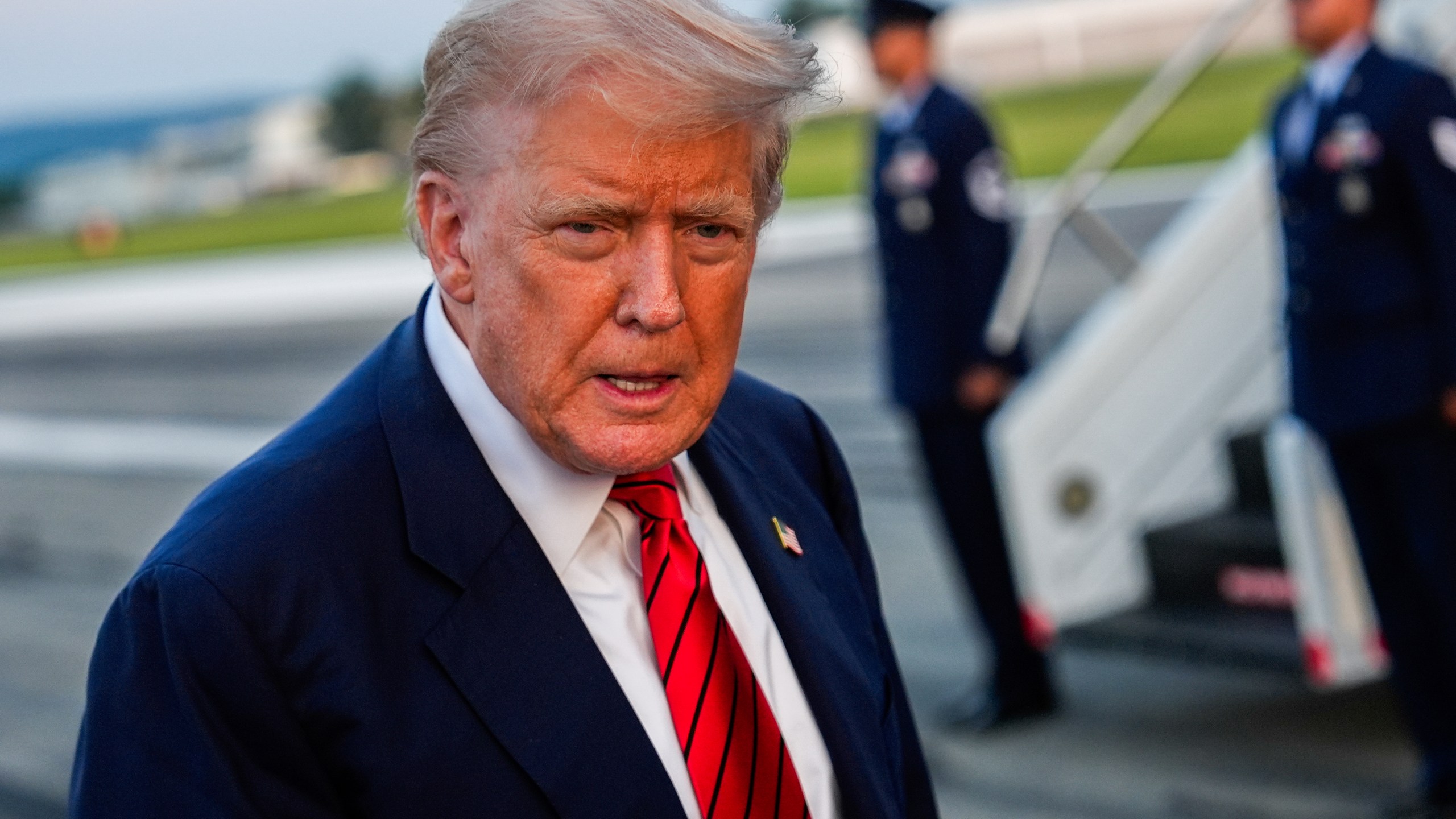 President Donald Trump speaks with reporters before boarding Air Force One at Lehigh Valley International Airport, Sunday, Aug. 3, 2025, in Allentown, Pa. (AP Photo/Julia Demaree Nikhinson)