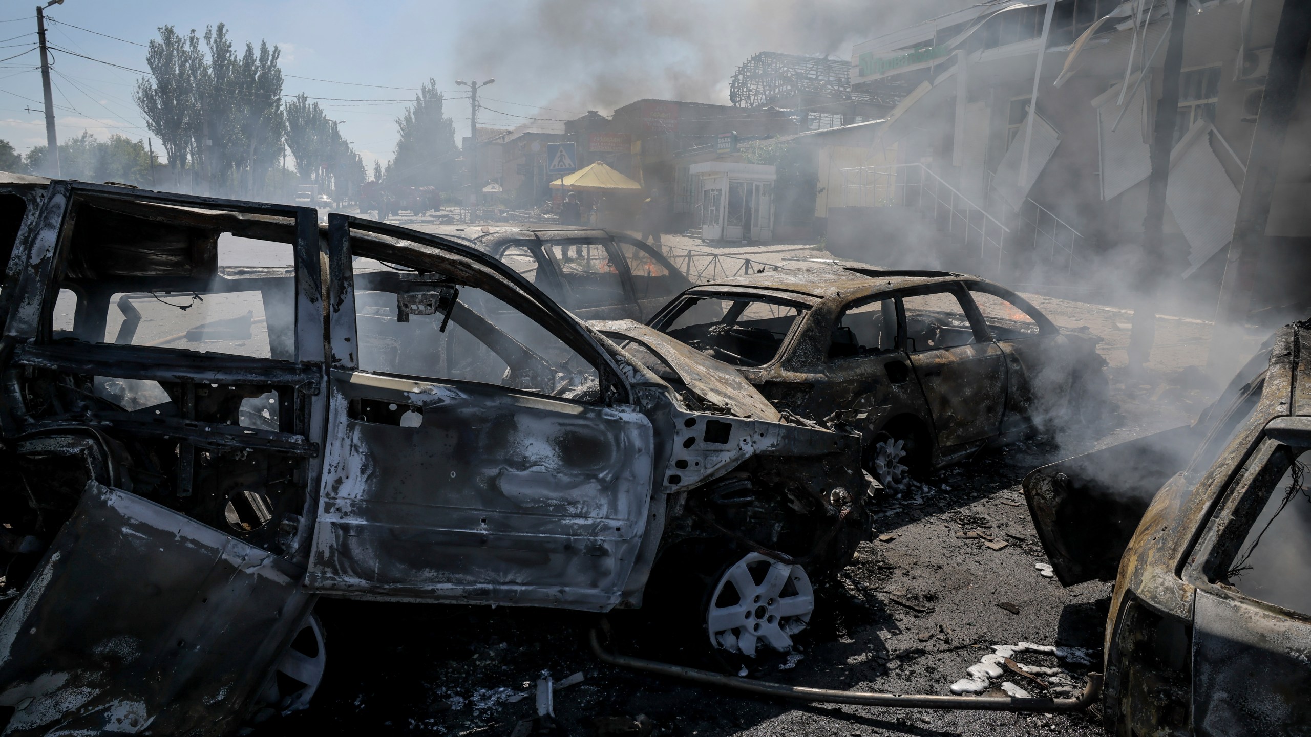 In this photo provided by Ukraine's 24th Mechanized Brigade press service, smoke rises after a Russian drone hit the market in the town of Druzhkivka, Donetsk region, Ukraine, Saturday, Aug. 2, 2025, (Oleg Petrasiuk/Ukraine's 24th Mechanized Brigade via AP)