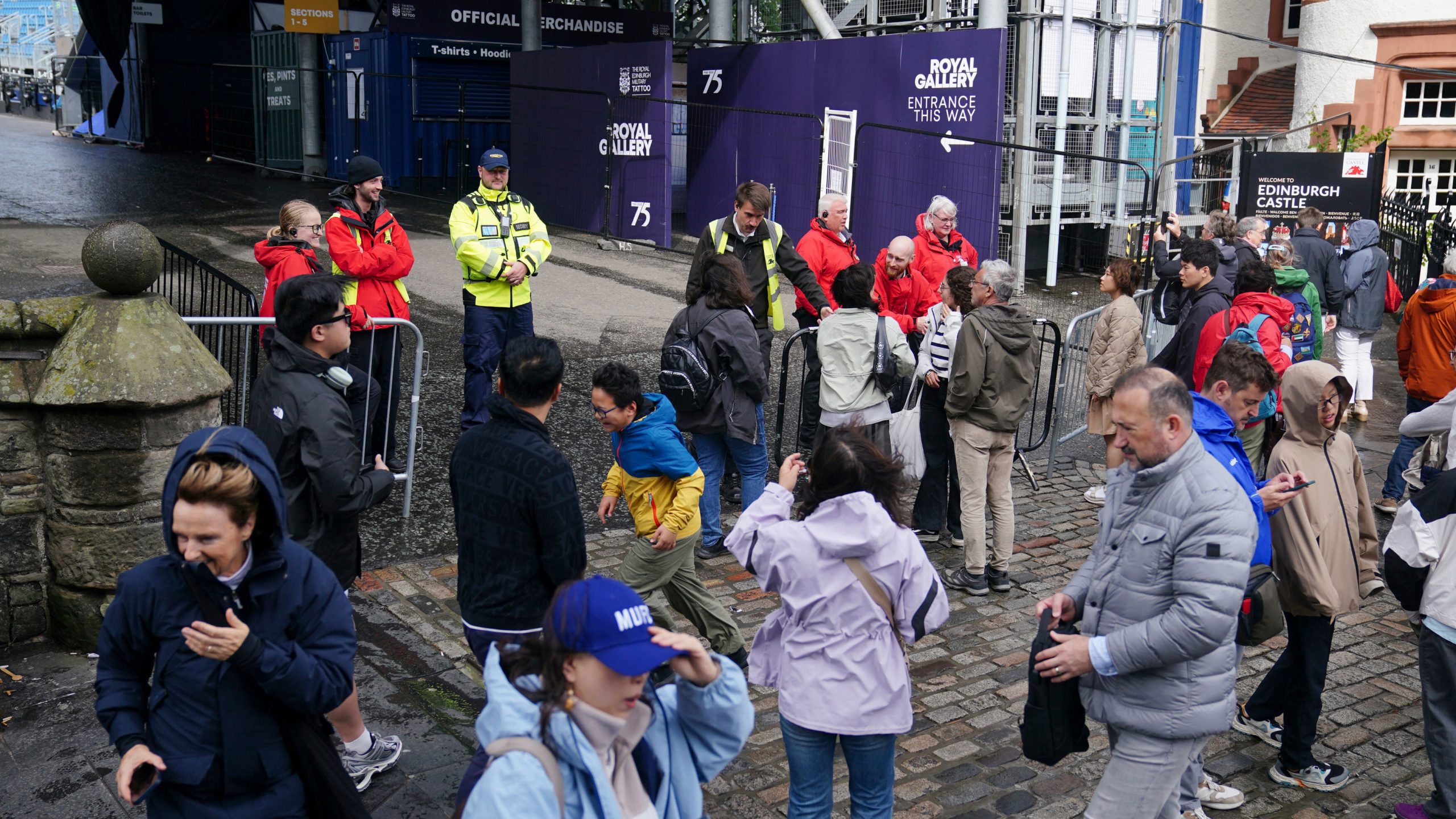 Members of the public are turned away from Edinburgh Castle as the site is closed to visitors due to high winds, in Scotland, Monday Aug. 4, 2025, as weather warnings are coming into force with Storm Floris expected to cause severe travel disruption to road, air and ferry services, and close bridges. (Jane Barlow/PA via AP)