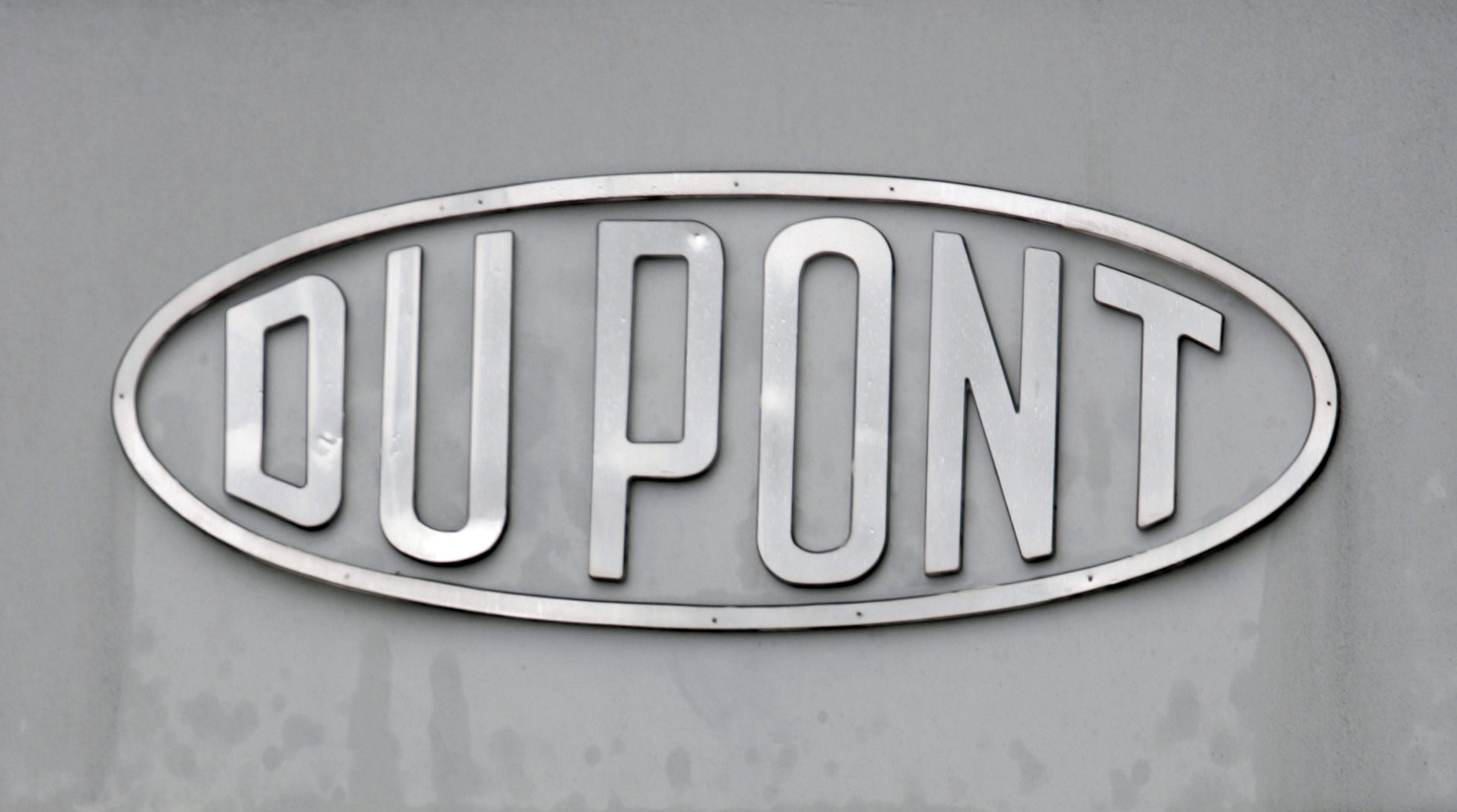 FILE - The DuPont logo is seen on a sign at the entrance to the company's Spruance Plant on April 22, 2008, in Richmond, Va. (AP Photo/Steve Helber, File)