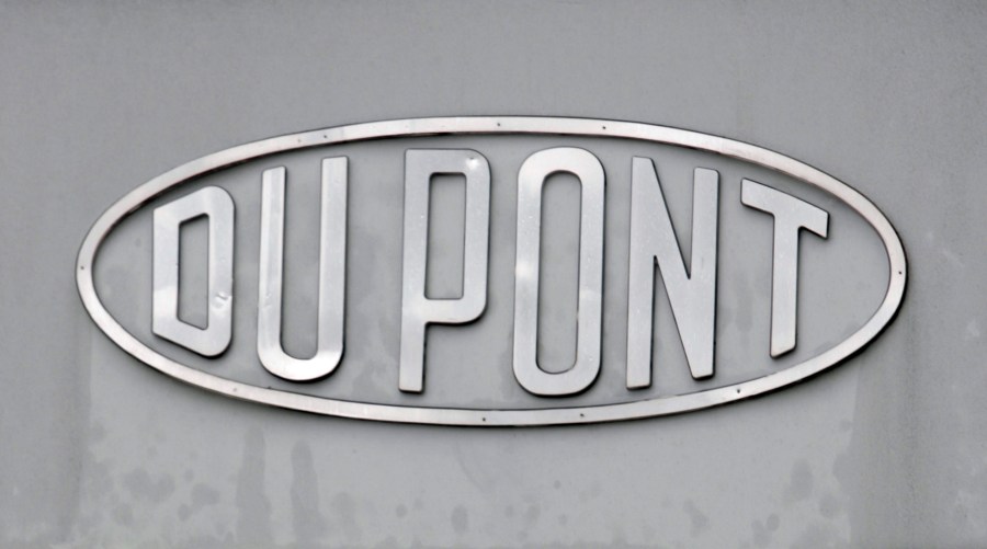 FILE - The DuPont logo is seen on a sign at the entrance to the company's Spruance Plant on April 22, 2008, in Richmond, Va. (AP Photo/Steve Helber, File)