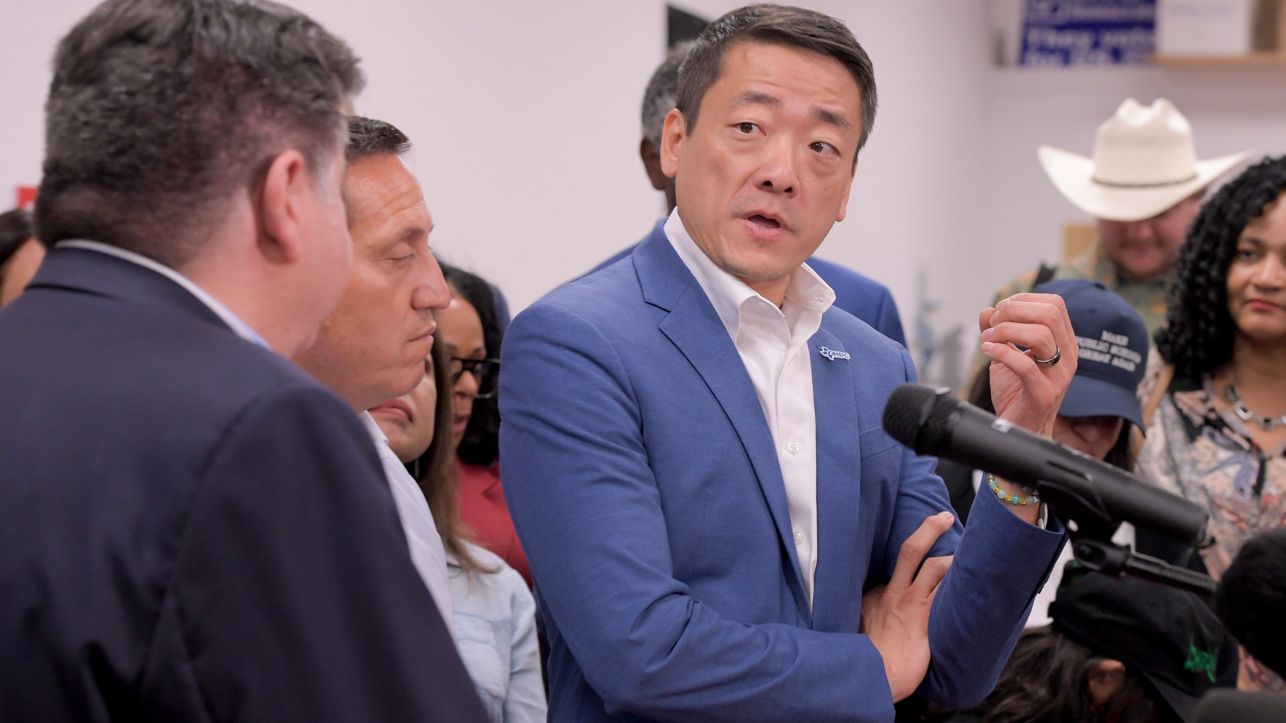 Texas House Democratic Caucus Chair Gene Wu along with other members of the Texas House are joined by Illinois Governor JB Pritzker as they speak about Texas Republican plans to redraw the House map office during a press conference at the Democratic Party of DuPage County office in Carol Stream, IL on Sunday, Aug. 3, 2025. (AP Photo/Mark Black)