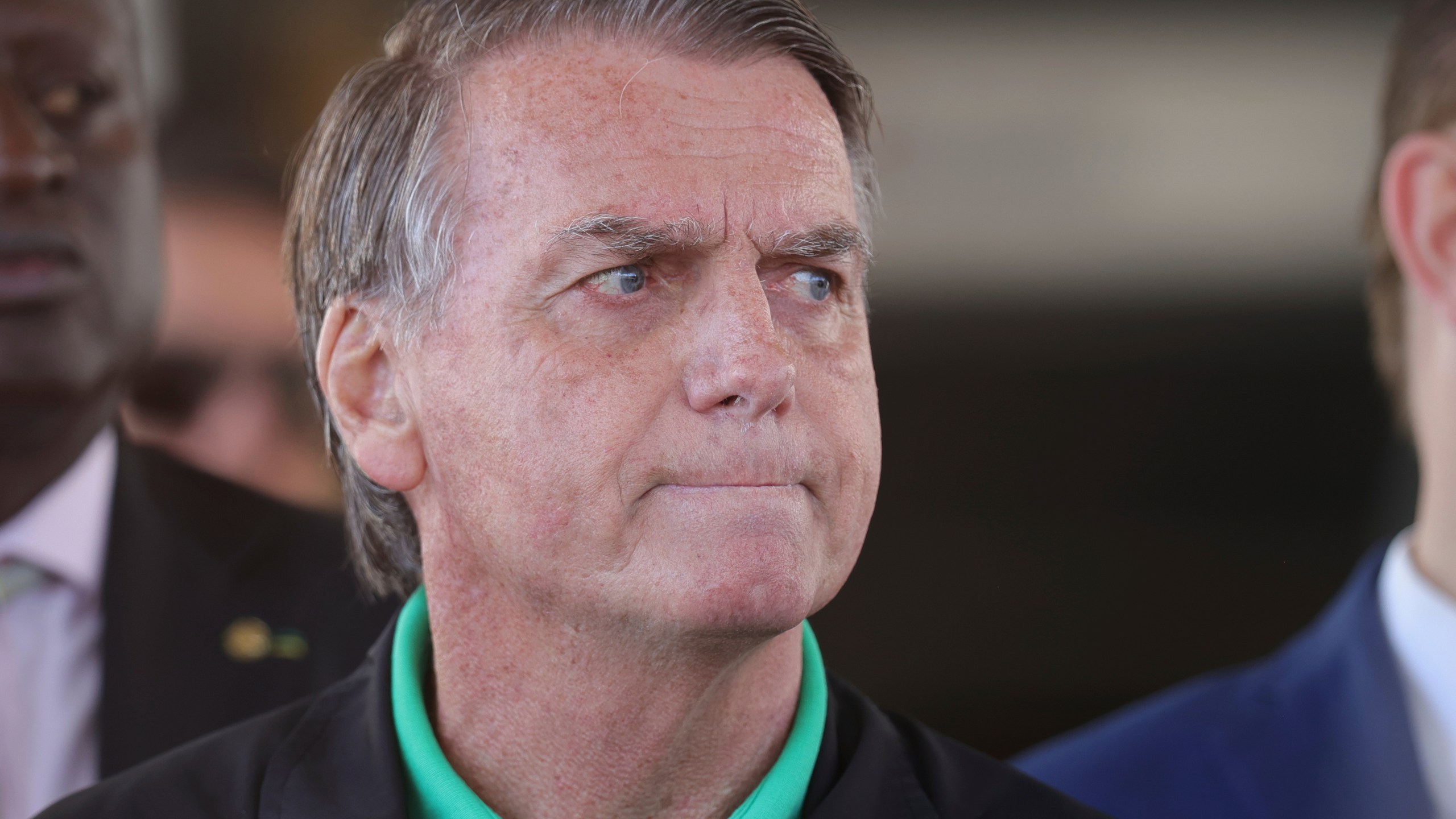 Brazil's former President Jair Bolsonaro gives a press conference outside the Senate in Brasilia, Brazil, Thursday, July 17, 2025. (AP Photo/Luis Nova)