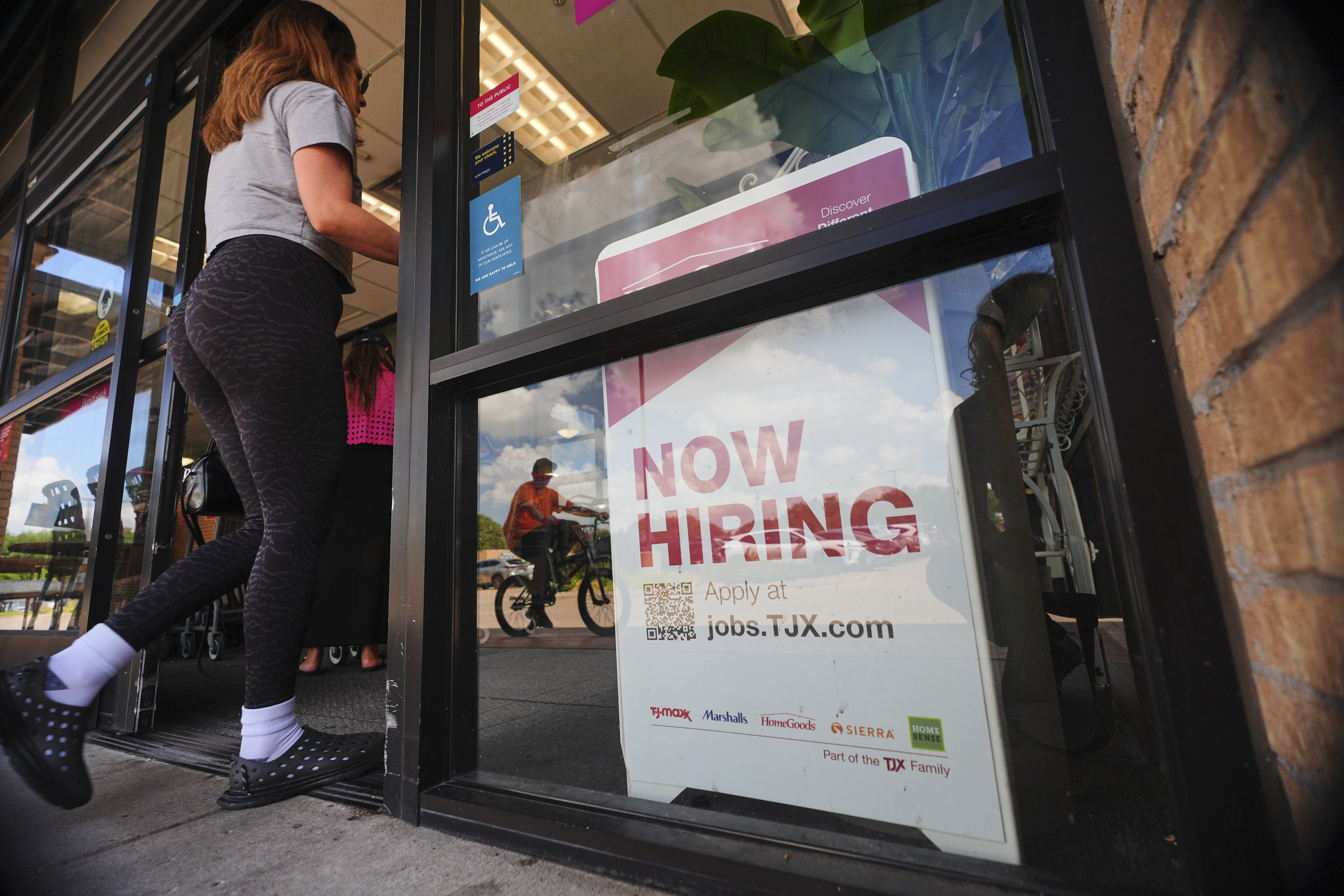 FILE- A sign announces hiring, July 15, 2025, in Richardson, Texas. (AP Photo/LM Otero, File)