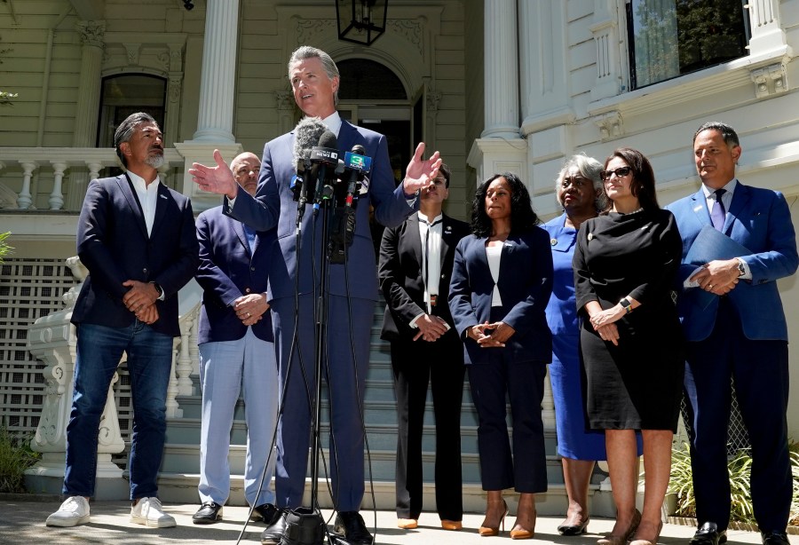 FILE - California Gov. Gavin Newsom, accompanied by several members of the Texas state Legislature, calls for a new way for California to redraw its voting districts, during a news conference In Sacramento, Calif., Friday July 25, 2025. (AP Photo by Rich Pedroncelli,File)