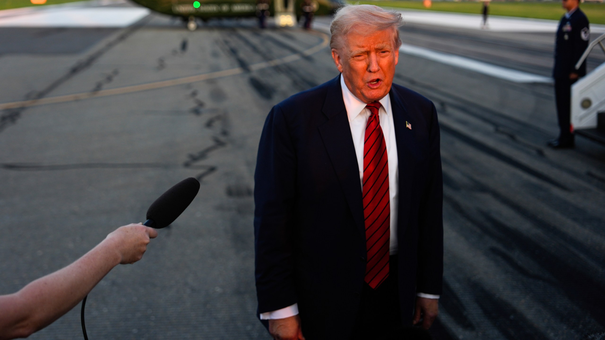 President Donald Trump speaks with reporters before boarding Air Force One at Lehigh Valley International Airport, Sunday, Aug. 3, 2025, in Allentown, Pa. (AP Photo/Julia Demaree Nikhinson)