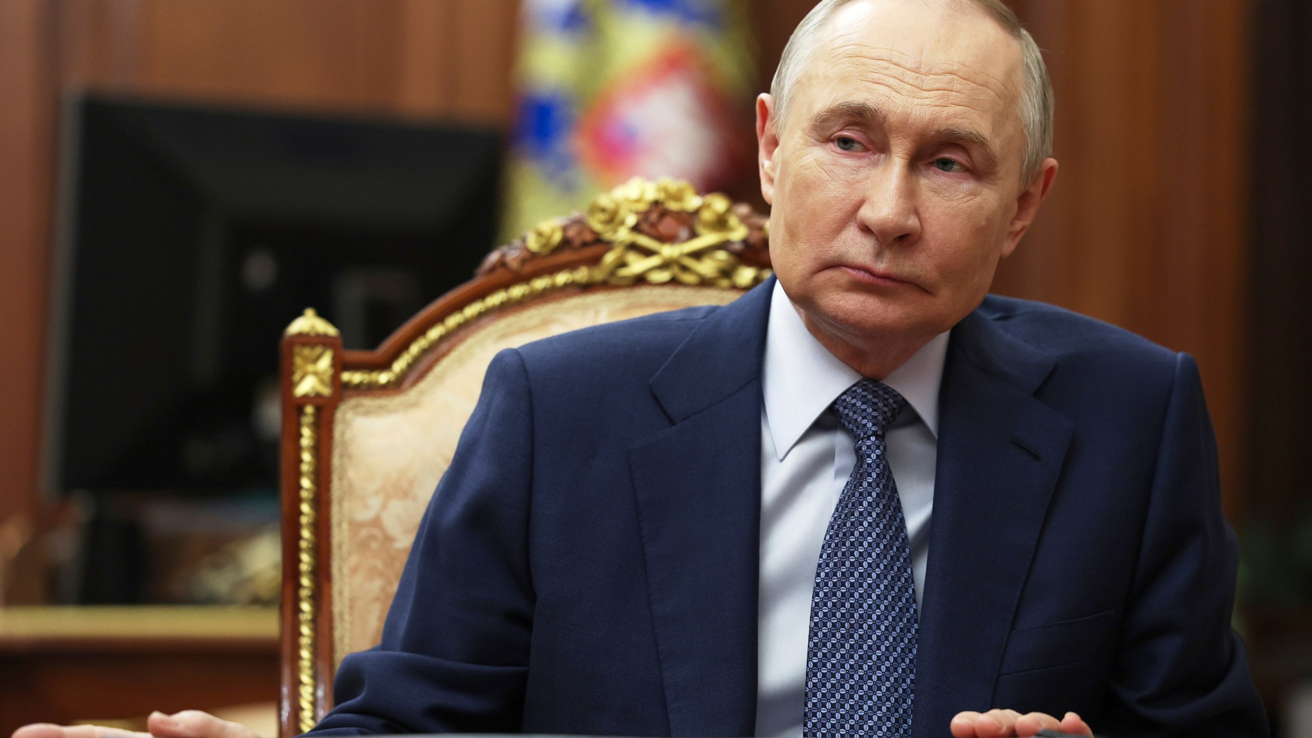 Russian President Vladimir Putin speaks with Sberbank CEO German Gref during their meeting at the Kremlin in Moscow, Russia, Tuesday, July 29, 2025. (Mikhail Metzel, Sputnik, Kremlin Pool Photo via AP)