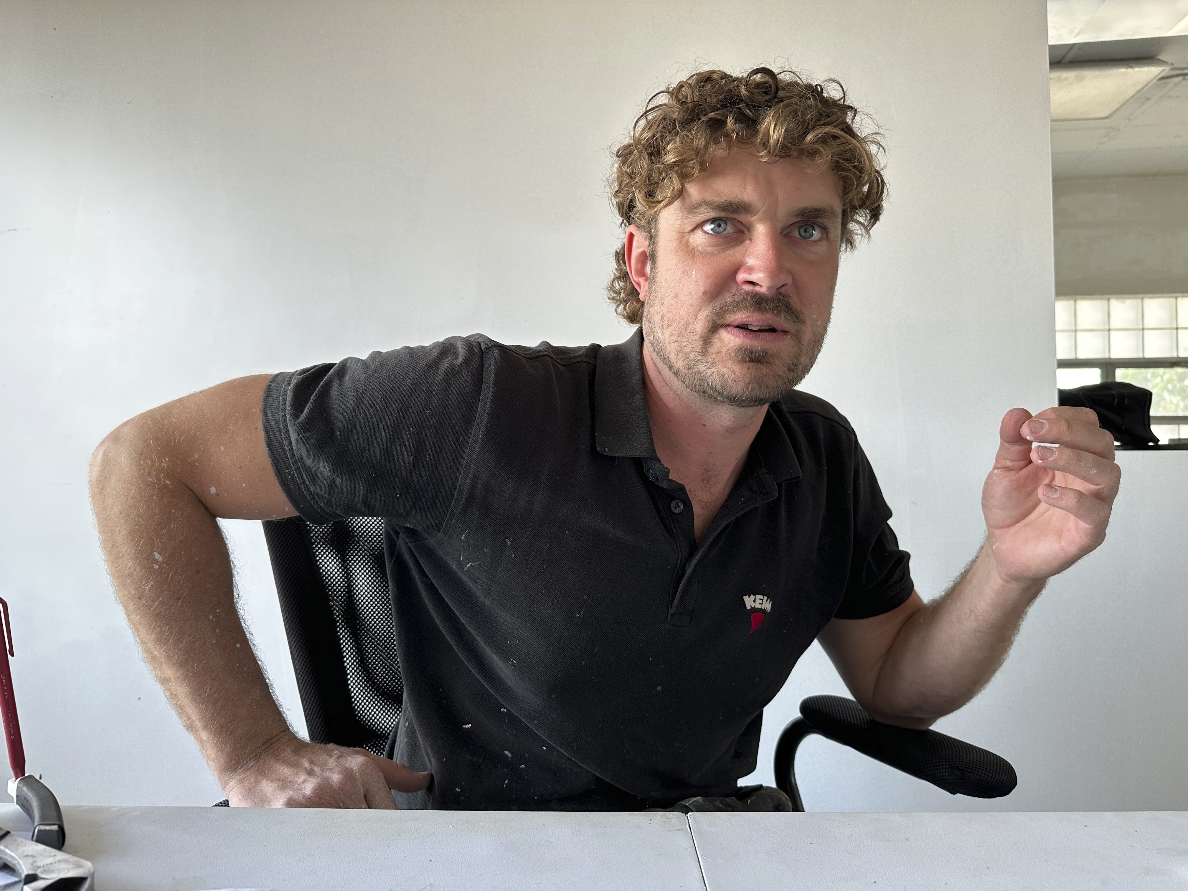 Artist Guido van Helten discusses his murals on Monday, July 14, 2025, in Minot, N.D. (AP Photo/Jack Dura)