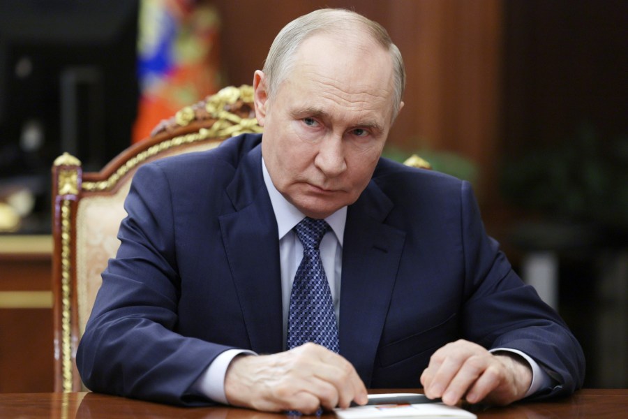 Russian President Vladimir Putin speaks with Igor Shuvalov, the chairman of the Russian state development corporation VEB.RF, during their meeting at the Kremlin in Moscow, Russia, Tuesday, Aug. 5, 2025. (Mikhail Metzel, Sputnik, Kremlin Pool Photo via AP)