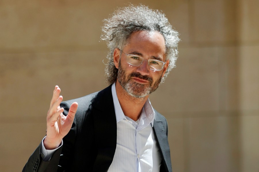 FILE - In this Wednesday, May 15, 2019, file photo, Palantir CEO Alex Karp arrives for the Tech for Good summit in Paris. (AP Photo/Thibault Camus, File)