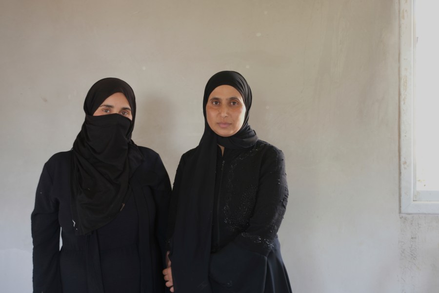 Sara Hathaleen and Myassar Hathaleen, two of dozens of Bedouin women on a hunger strike demanding that Israel return the body of a Palestinian activist killed during a clash with a Jewish settler, are seen in Umm al-Khair, West Bank, Monday, Aug. 4, 2025. (AP Photo/Julia Frankel)
