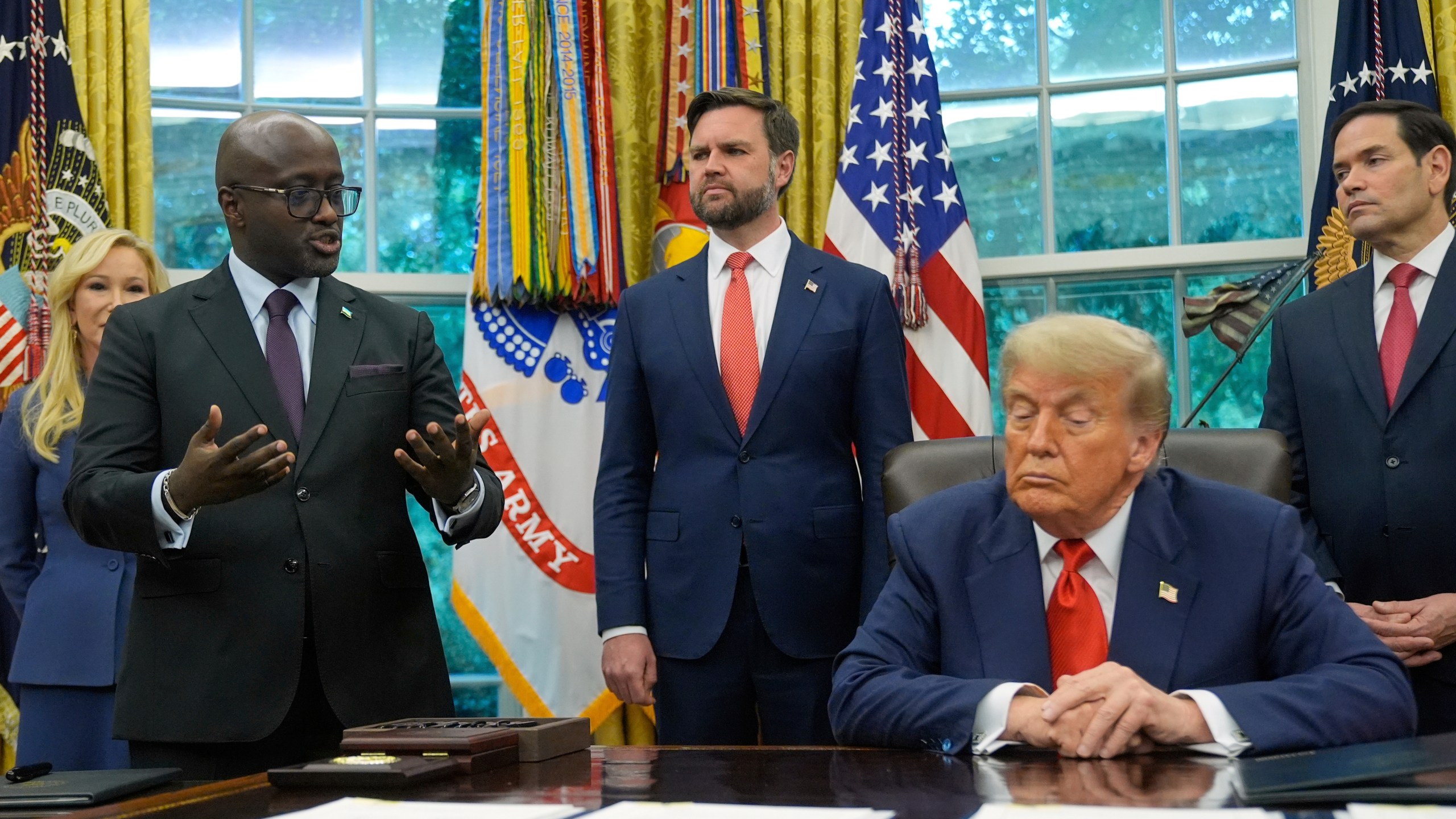 FILE -President Donald Trump listens as Rwanda's Foreign Minister Olivier Nduhungirehe speaks during a event with Congo's Foreign Minister Therese Kayikwamba Wagner, June 27, 2025, in the Oval Office at the White House in Washington, as Vice President JD Vance and Secretary of State Marco Rubio, watch. (AP Photo/Manuel Balce Ceneta), File)