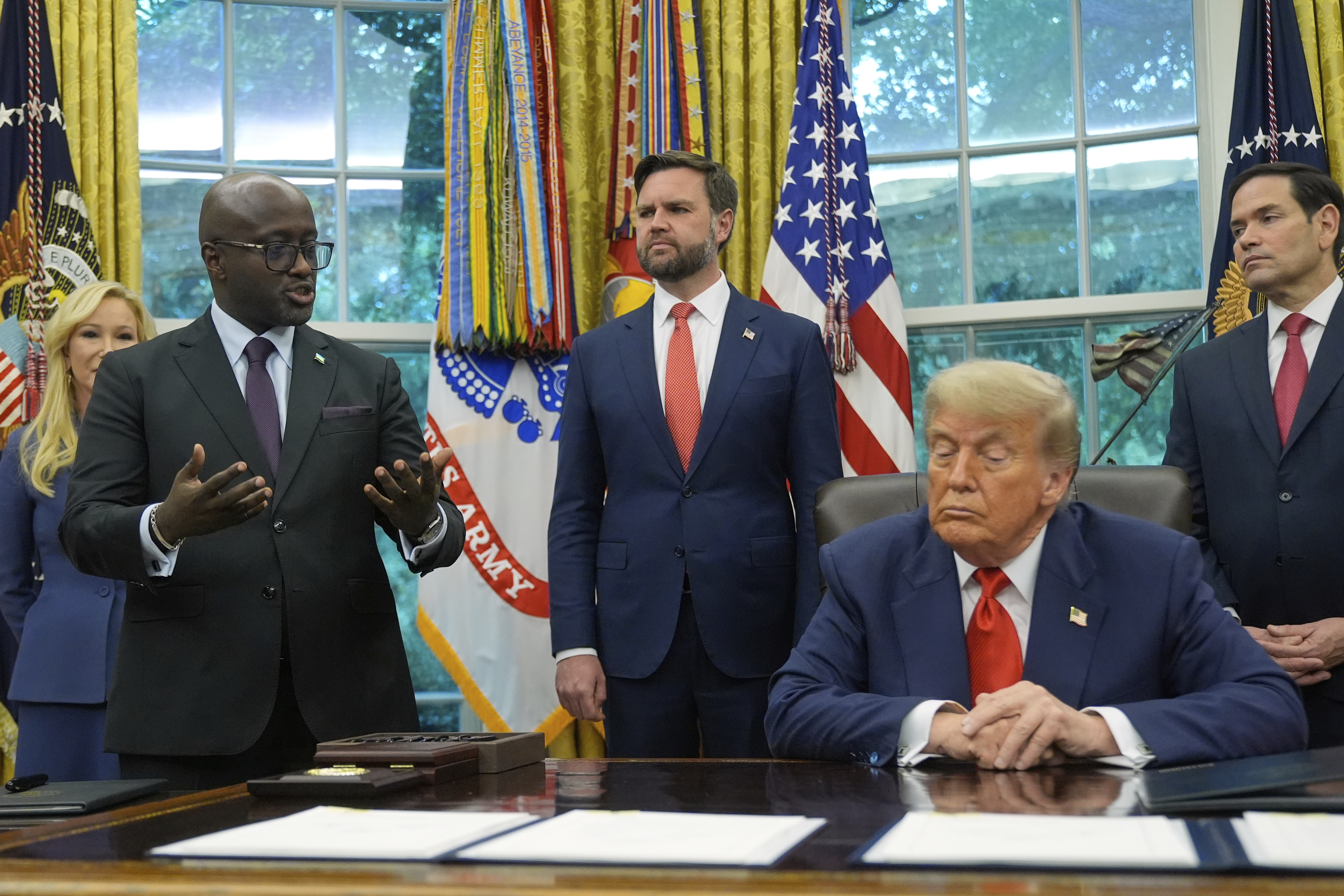 FILE -President Donald Trump listens as Rwanda's Foreign Minister Olivier Nduhungirehe speaks during a event with Congo's Foreign Minister Therese Kayikwamba Wagner, June 27, 2025, in the Oval Office at the White House in Washington, as Vice President JD Vance and Secretary of State Marco Rubio, watch. (AP Photo/Manuel Balce Ceneta), File)