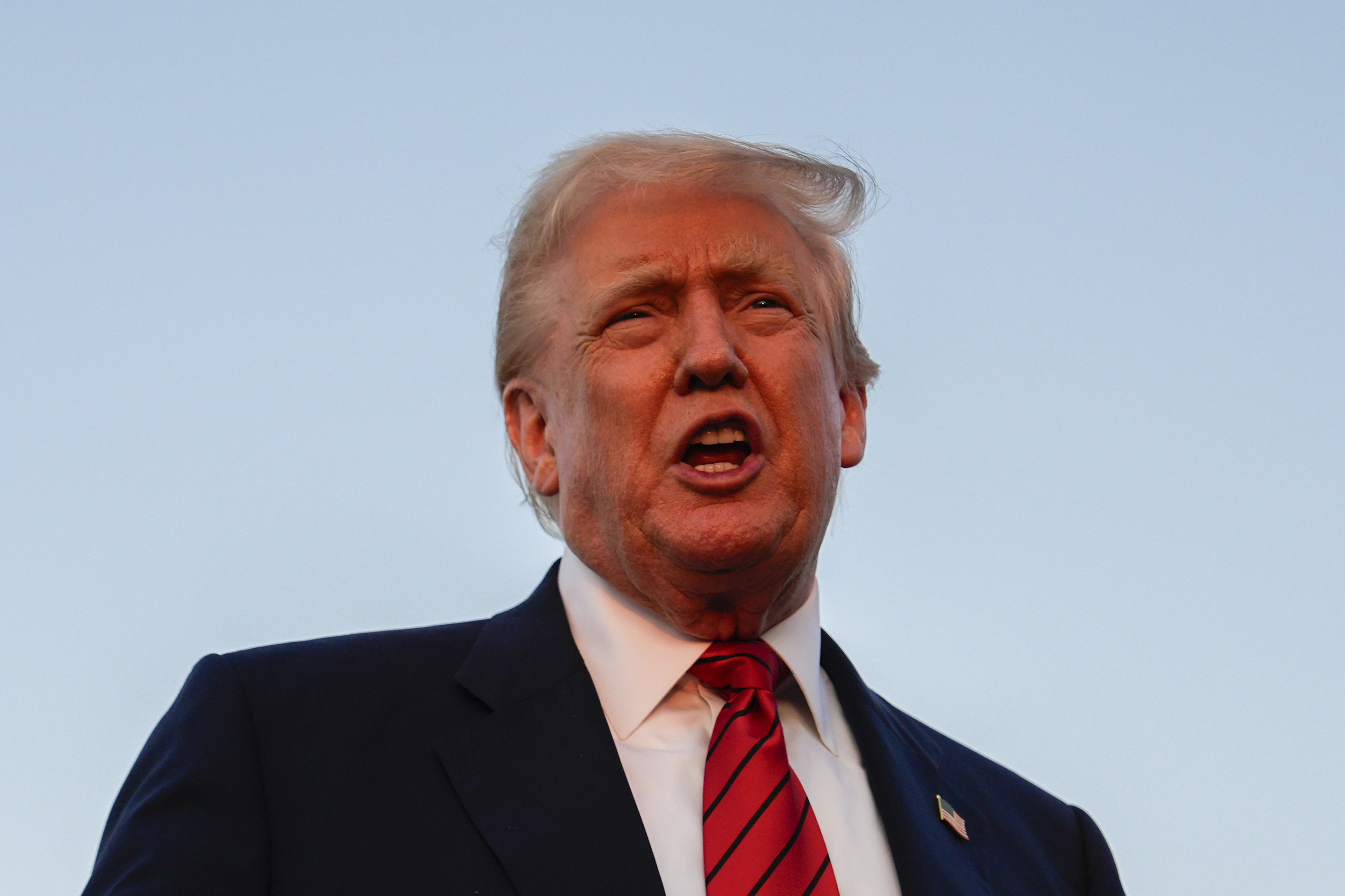 President Donald Trump speaks with reporters before boarding Air Force One at Lehigh Valley International Airport, Sunday, Aug. 3, 2025, in Allentown, Pa. (AP Photo/Julia Demaree Nikhinson)