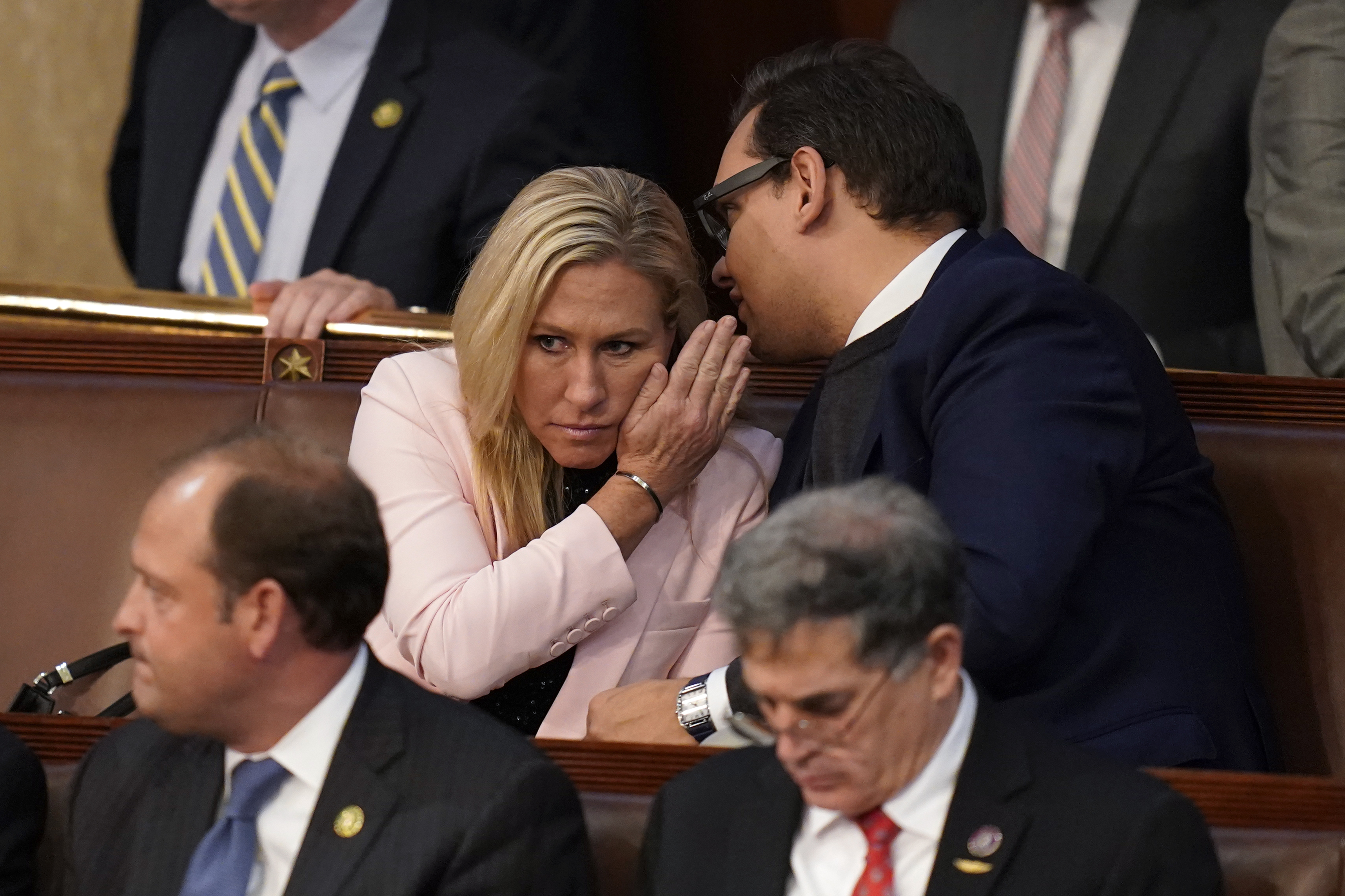 FILE - Rep.-elect George Santos, R-N.Y., right, talks with Rep. Marjorie Taylor Greene, R-Ga., during the ninth vote in the House chamber as the House meets for the third day to elect a speaker and convene the 118th Congress in Washington, Thursday, Jan. 5, 2023. (AP Photo/Alex Brandon, File)