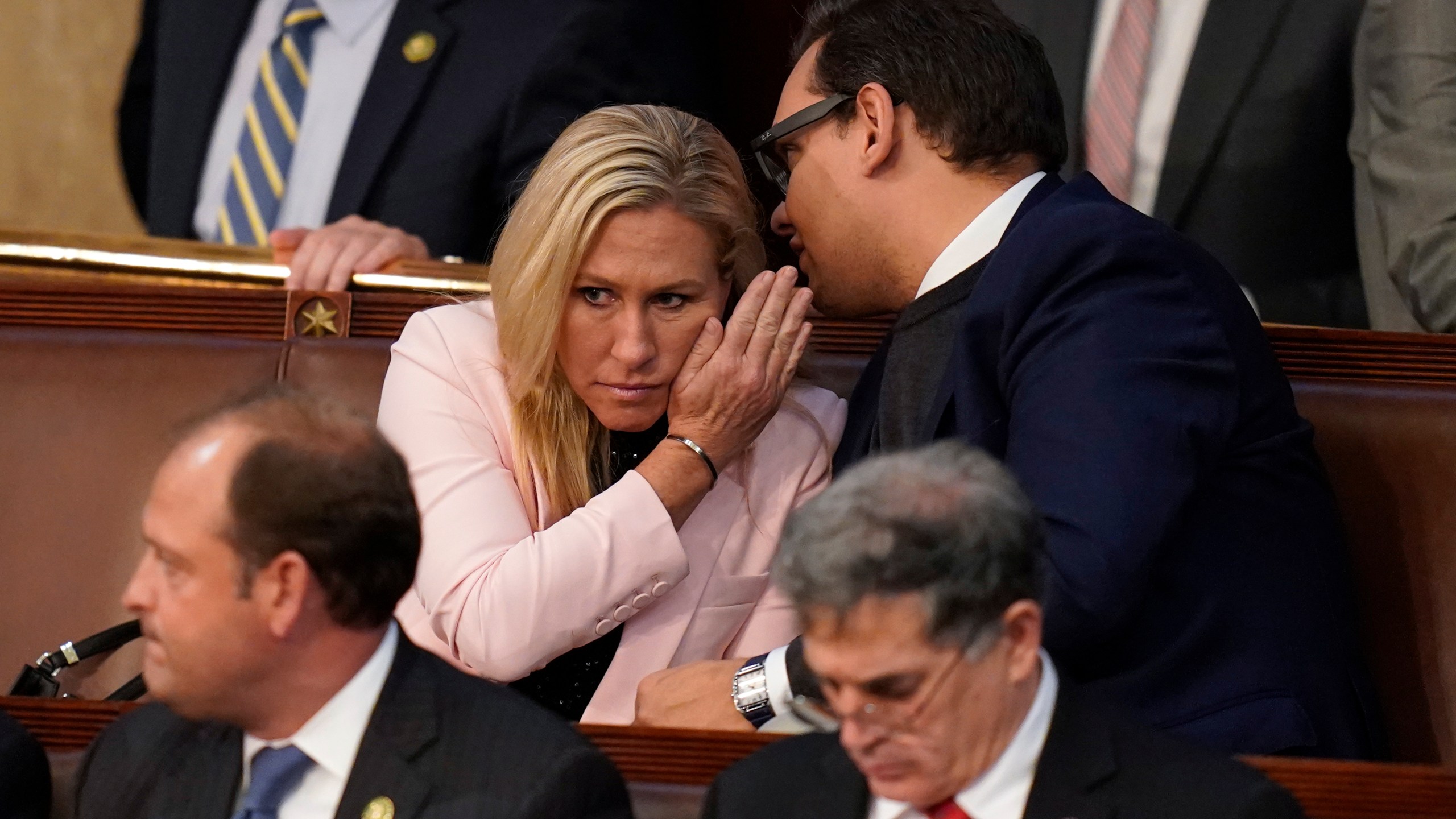 FILE - Rep.-elect George Santos, R-N.Y., right, talks with Rep. Marjorie Taylor Greene, R-Ga., during the ninth vote in the House chamber as the House meets for the third day to elect a speaker and convene the 118th Congress in Washington, Thursday, Jan. 5, 2023. (AP Photo/Alex Brandon, File)