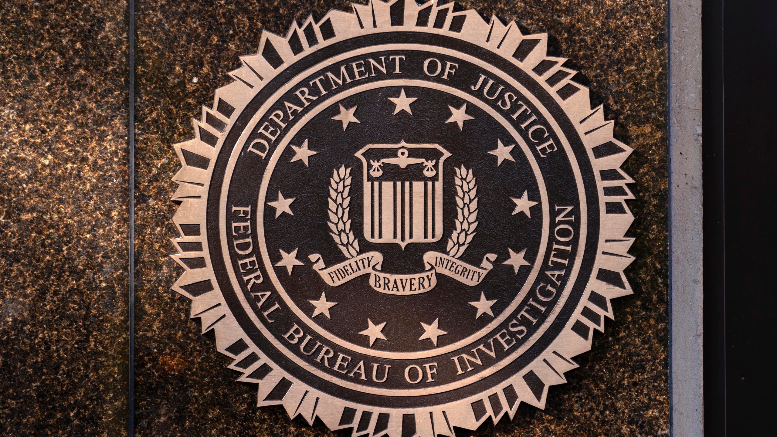 FILE - The seal of The Federal Bureau of Investigation is seen on the Headquarters in Washington, Nov. 18, 2024. (AP Photo/Jose Luis Magana, File)