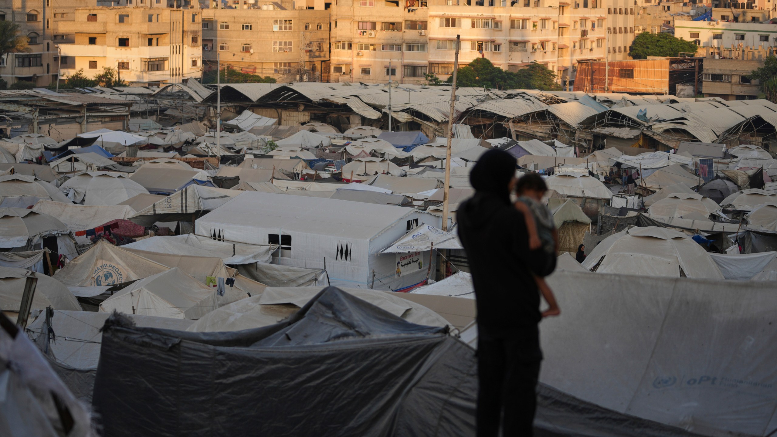 A tent camp for displaced Palestinians stretches along Gaza City, Sunday, Aug. 3, 2025. (AP Photo/Jehad Alshrafi)