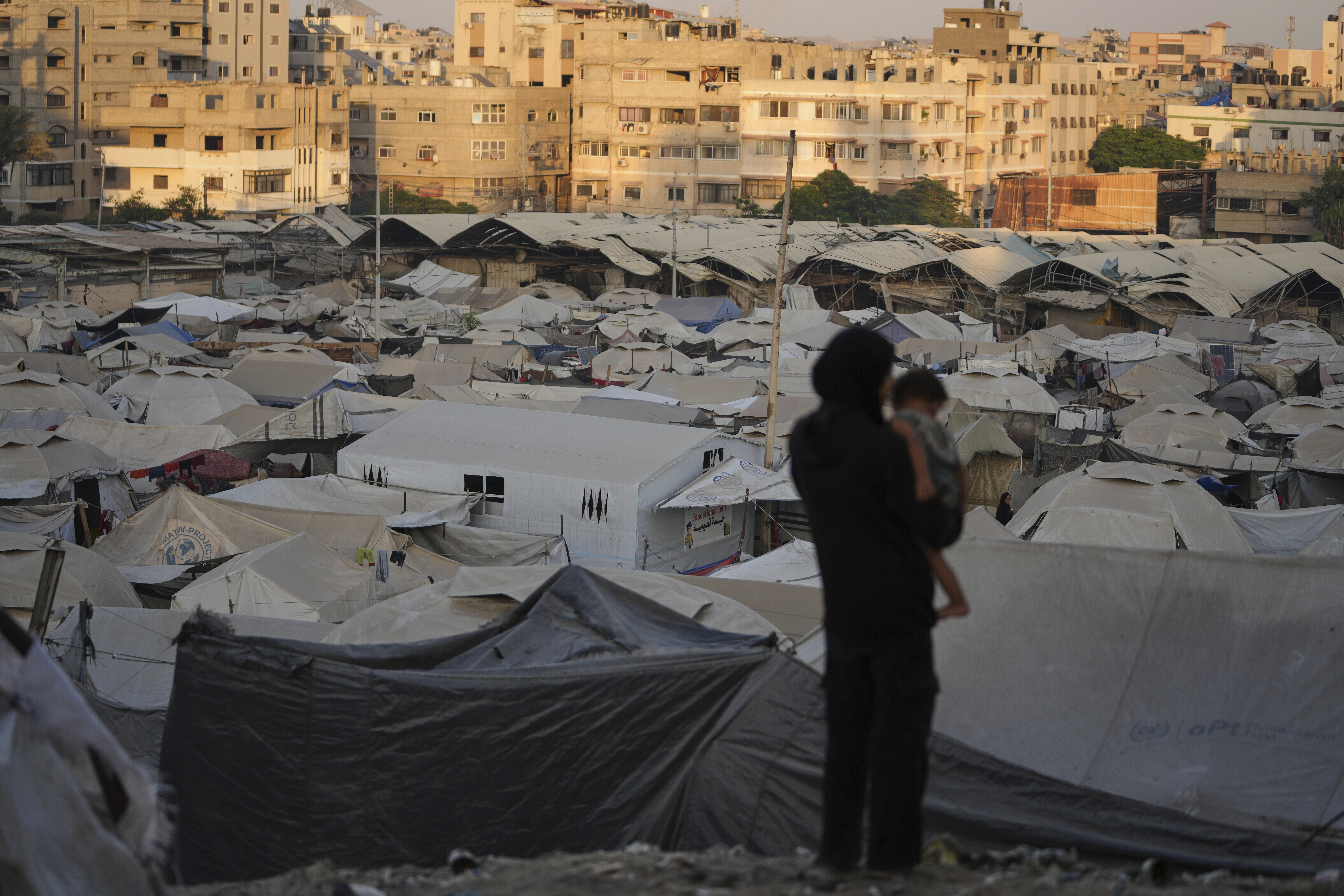 A tent camp for displaced Palestinians stretches along Gaza City, Sunday, Aug. 3, 2025. (AP Photo/Jehad Alshrafi)