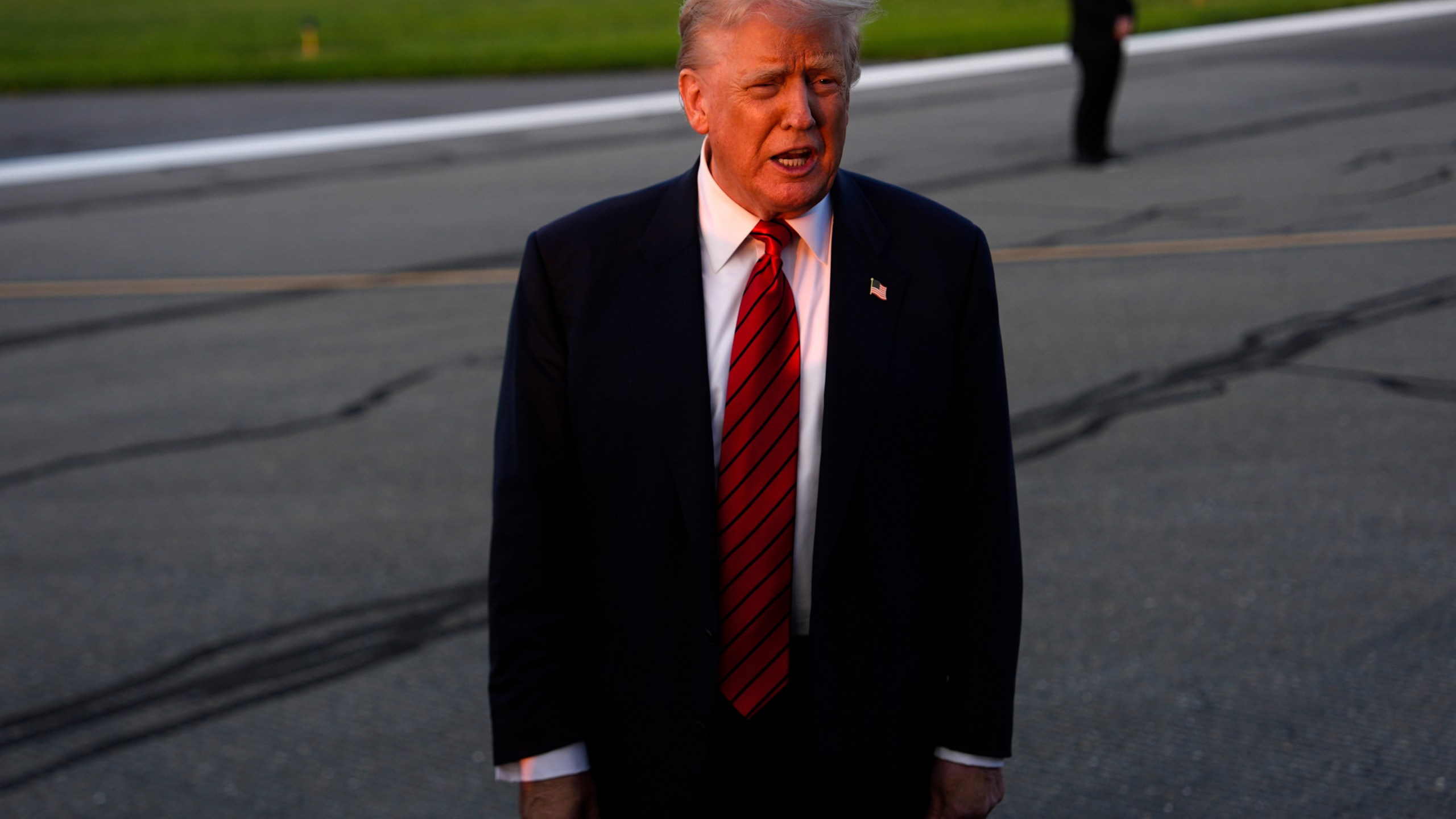 President Donald Trump speaks with reporters before boarding Air Force One at Lehigh Valley International Airport, Sunday, Aug. 3, 2025, in Allentown, Pa. (AP Photo/Julia Demaree Nikhinson)