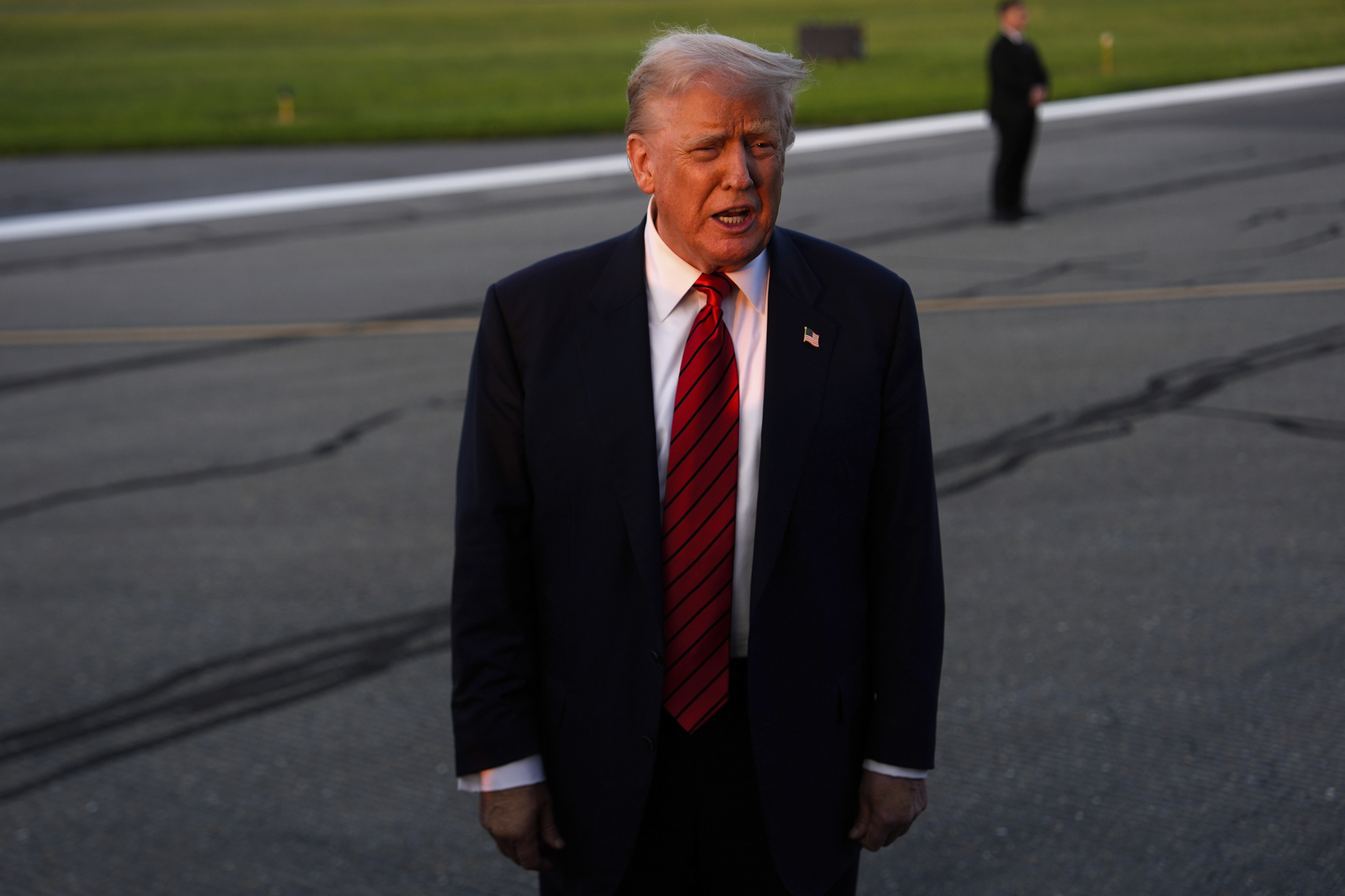 President Donald Trump speaks with reporters before boarding Air Force One at Lehigh Valley International Airport, Sunday, Aug. 3, 2025, in Allentown, Pa. (AP Photo/Julia Demaree Nikhinson)