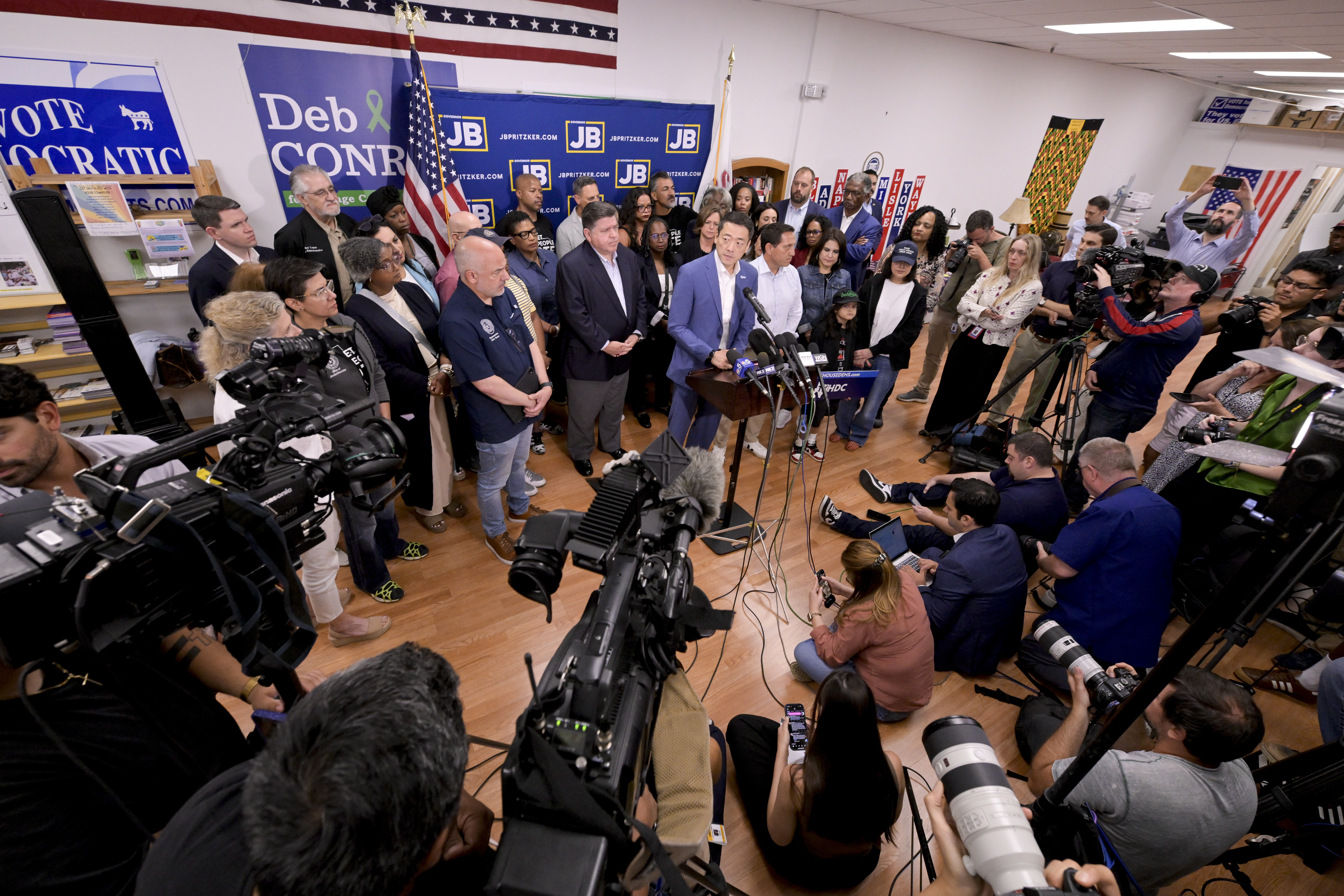 Texas House Democratic Caucus Chair Gene Wu along with other members of the Texas House are joined by Illinois Governor JB Pritzker as they speak about Texas Republican plans to redraw the House map office during a press conference at the Democratic Party of DuPage County office in Carol Stream, IL on Sunday, Aug. 3, 2025. (AP Photo/Mark Black)