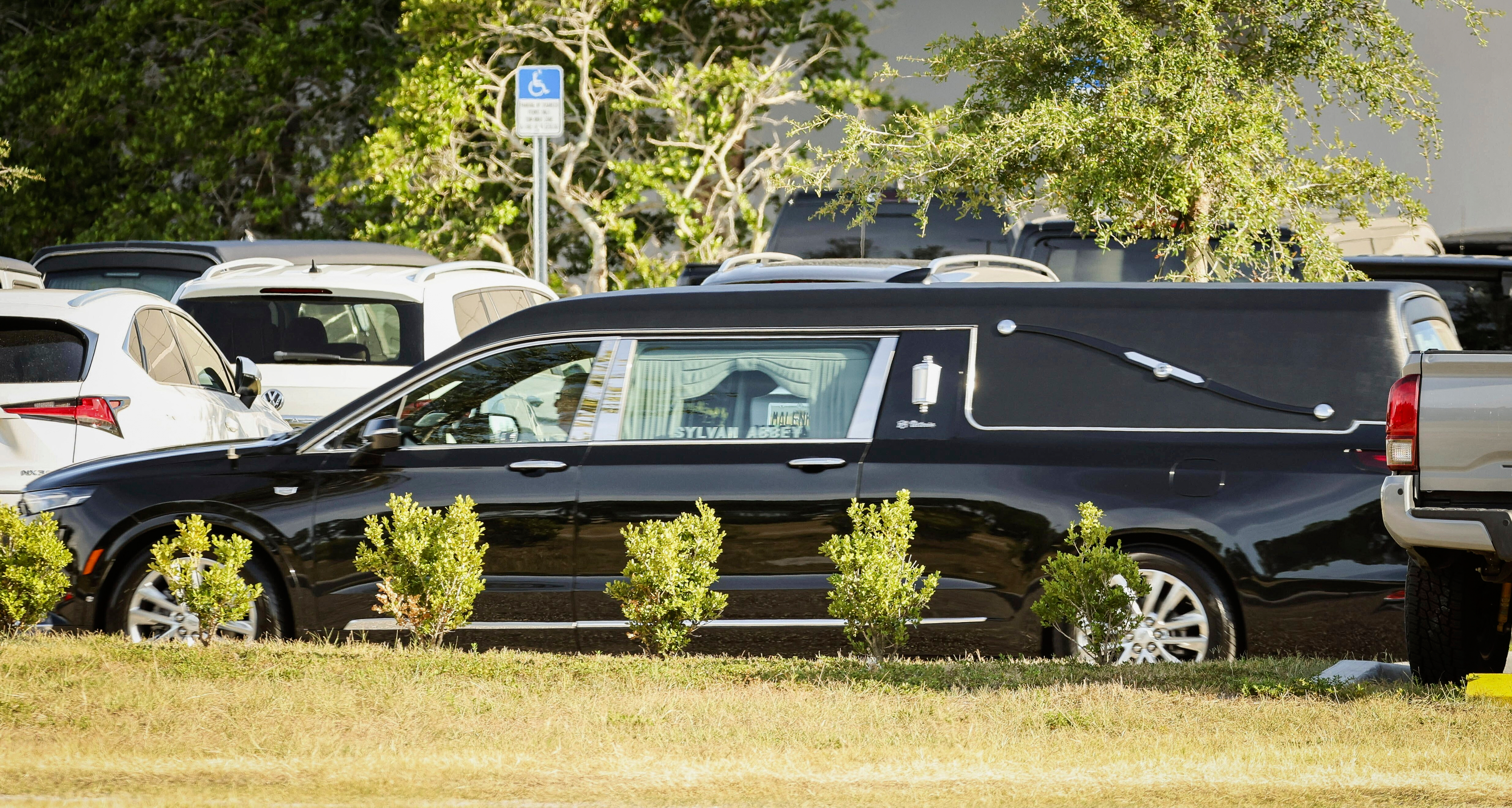 A hearse containing the remains of Terry Bollea, better know as wrestler Hulk Hogan, leaves after a memorial service at Indian Rocks Baptist Church, Tuesday, Aug. 5, 2025, in Largo, Fla. (Luis Santana/Tampa Bay Times via AP)