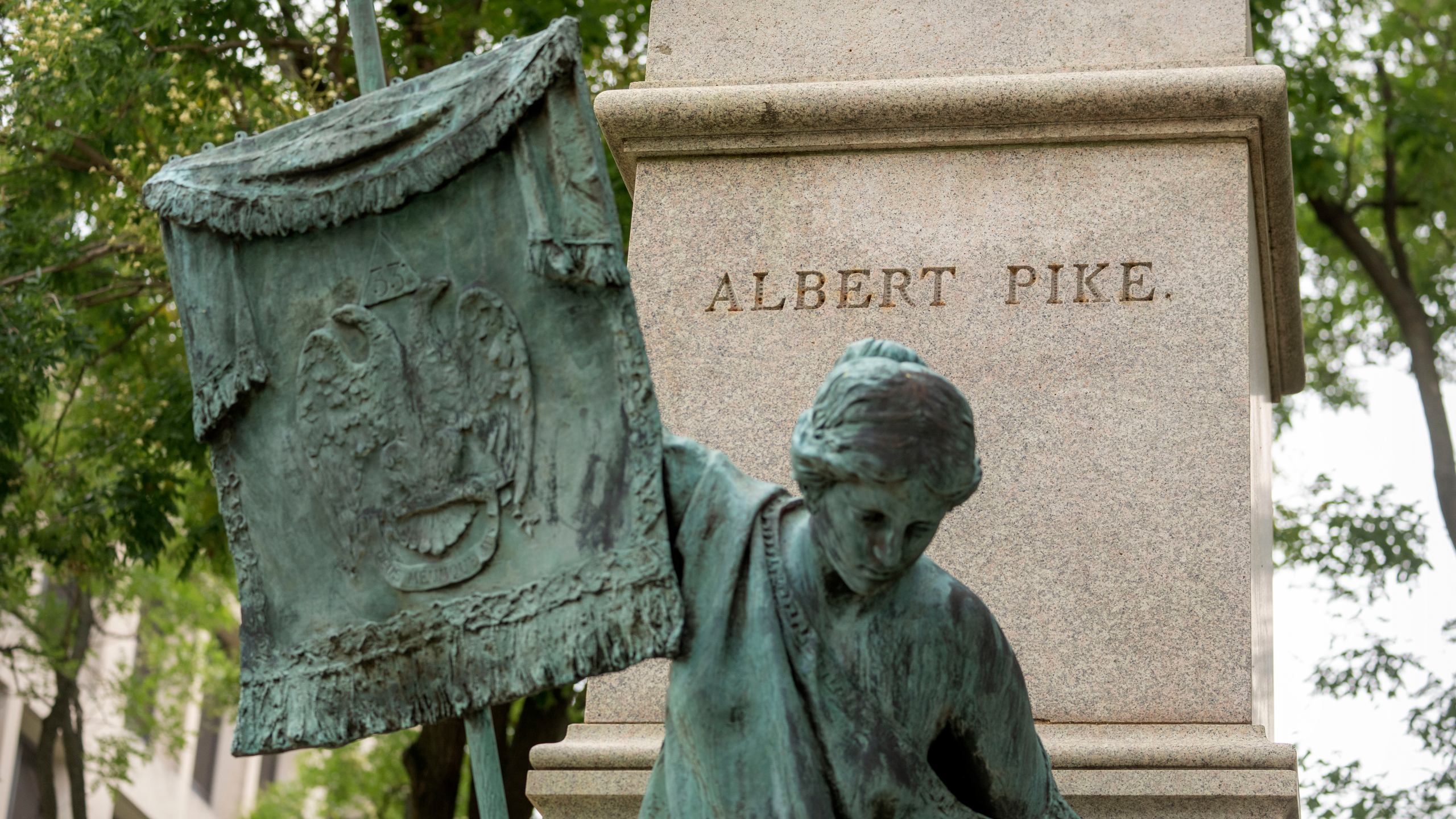 A plinth that once held a statue of Confederate general Albert Pike is seen in a park near the headquarters of the Department of Labor on Tuesday, Aug. 5, 2025, in Washington. (AP Photo/Mark Schiefelbein)