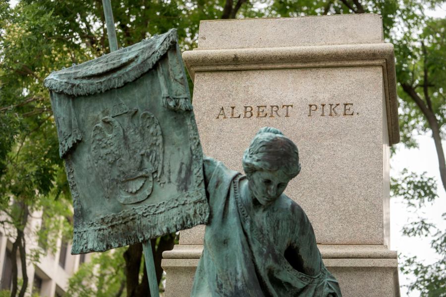 A plinth that once held a statue of Confederate general Albert Pike is seen in a park near the headquarters of the Department of Labor on Tuesday, Aug. 5, 2025, in Washington. (AP Photo/Mark Schiefelbein)