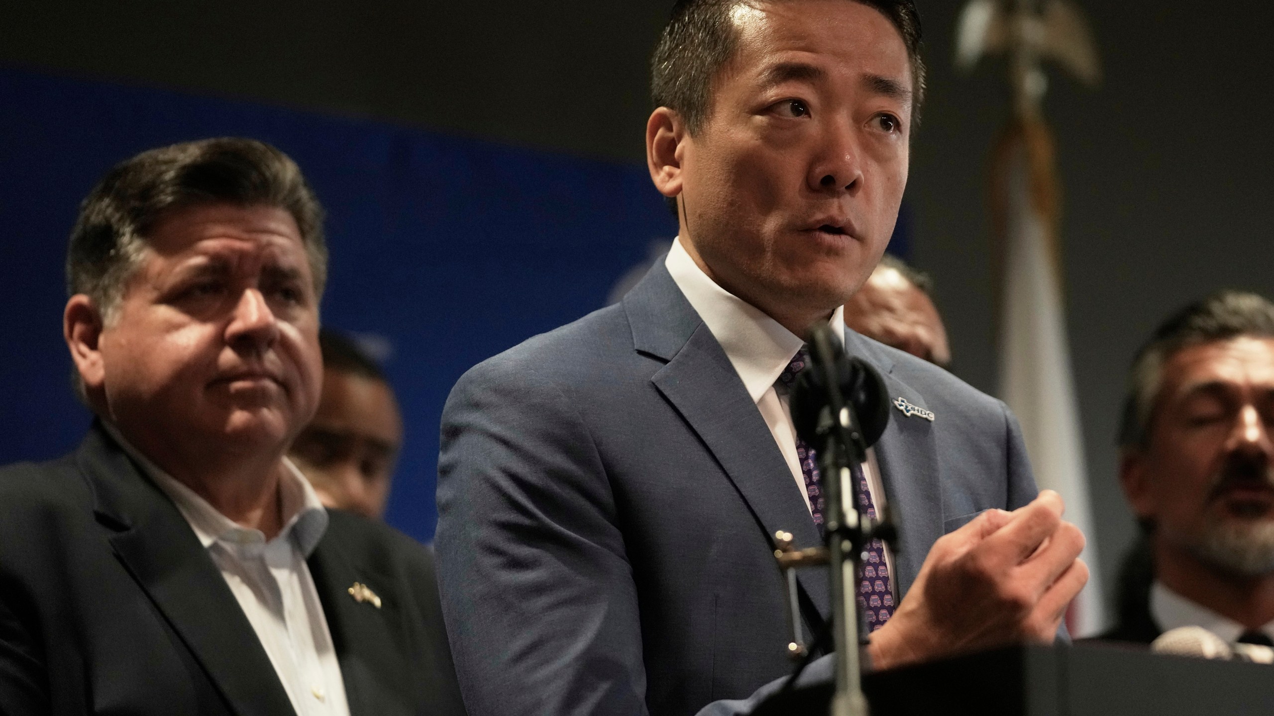 CORRECTS CITY TO AURORA, ILL., Texas Rep. Gene Wu speaks as Illinois Governor JB Pritzker looks on during a news conference in Aurora, Ill,, on Tuesday, Aug 5, 2025. (AP Photo/Erin Hooley)